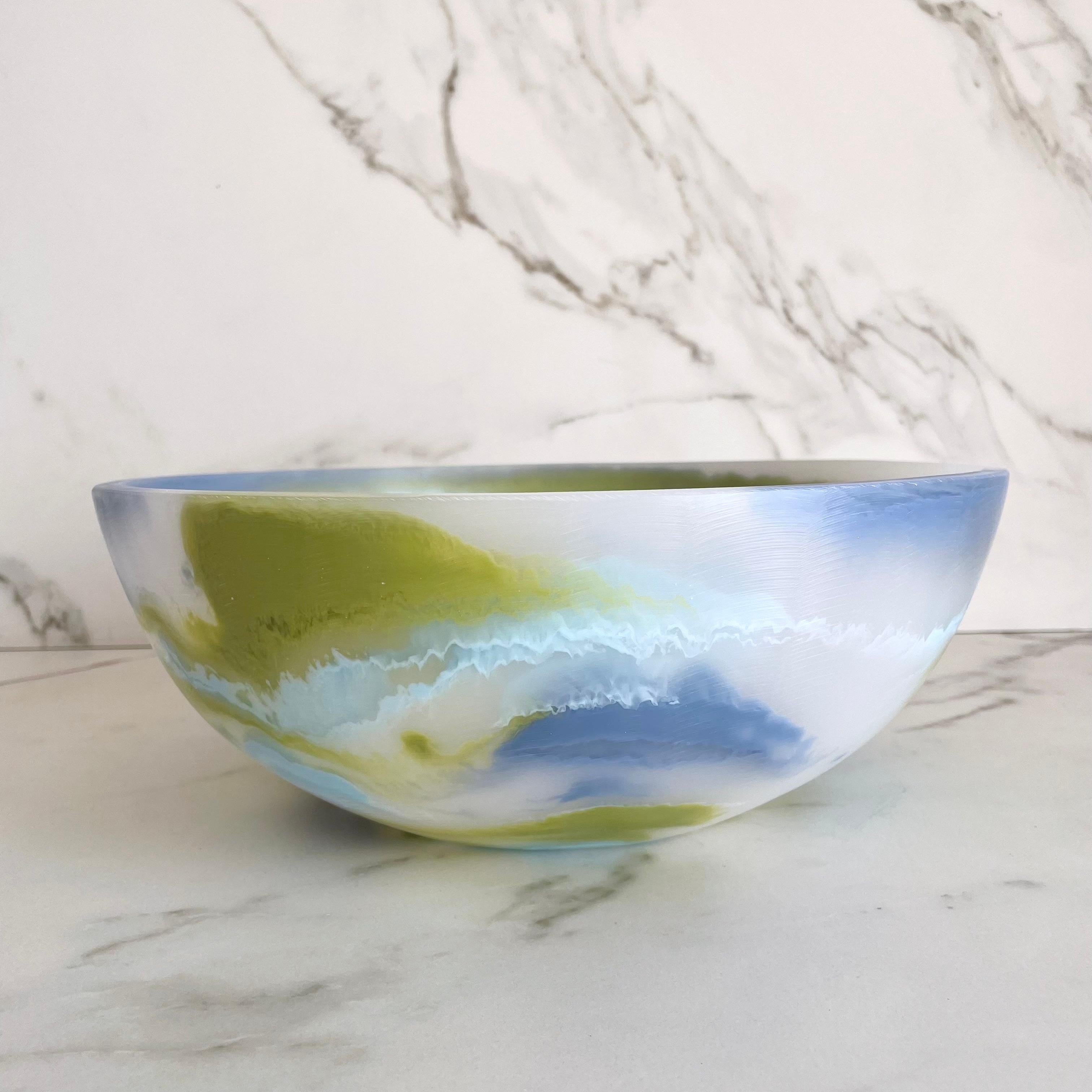 Our colorful bowl is handmade in traslucid white resin with marbled texture in lime green, light blue and cobalt blue. Its fun and colorful design makes it a statement piece and can be used as decor,fruit platter or to serve cold food.

Designed