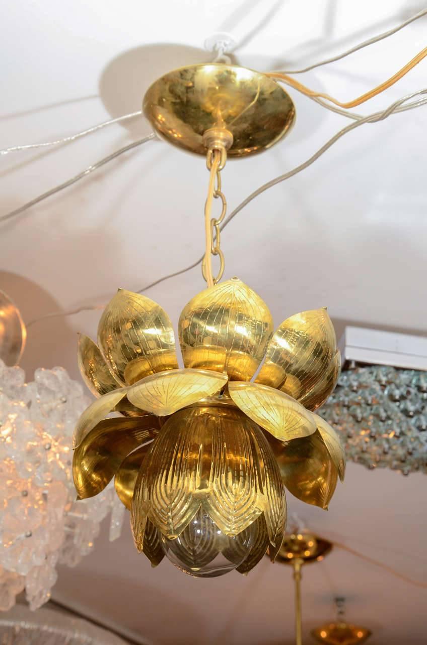Medium brass lotus form pendant ceiling fixtures by Feldman.