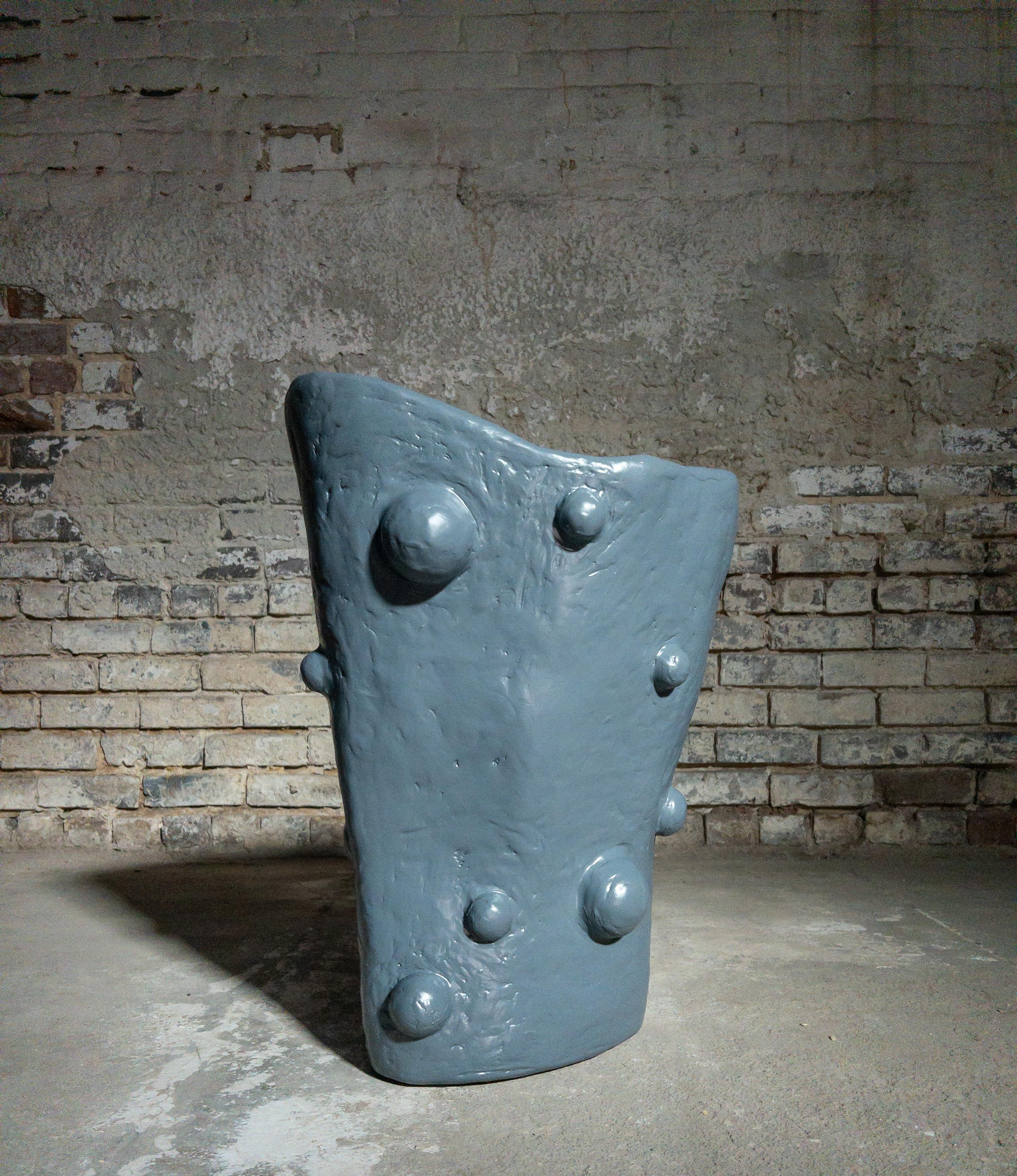 The Medium Breakout Vase by Brent Warr is a sculptural statement piece that embraces organic form and material experimentation. Hand-shaped from a proprietary blend of gypsum, pulp, and epoxy, the vase features a fluid, asymmetrical silhouette