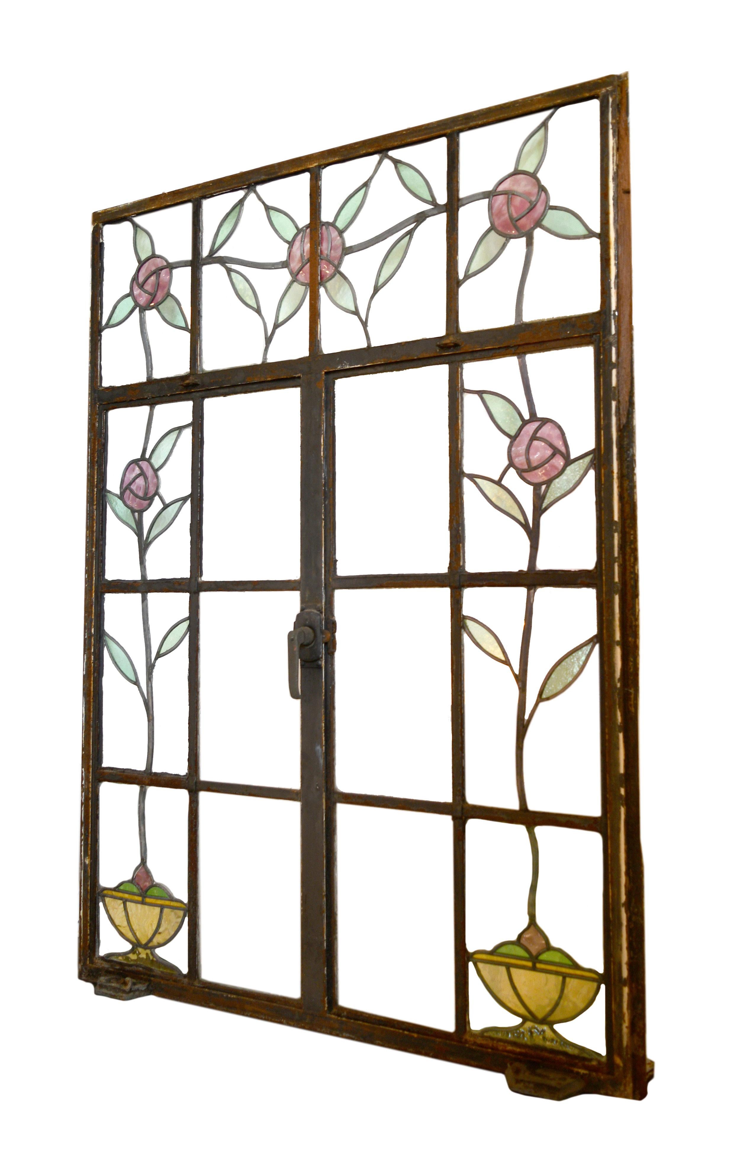 This stunning casement window features lovely stained glass roses winding throughout the frame. This window is in great condition with only one small crack within the glass.
          
