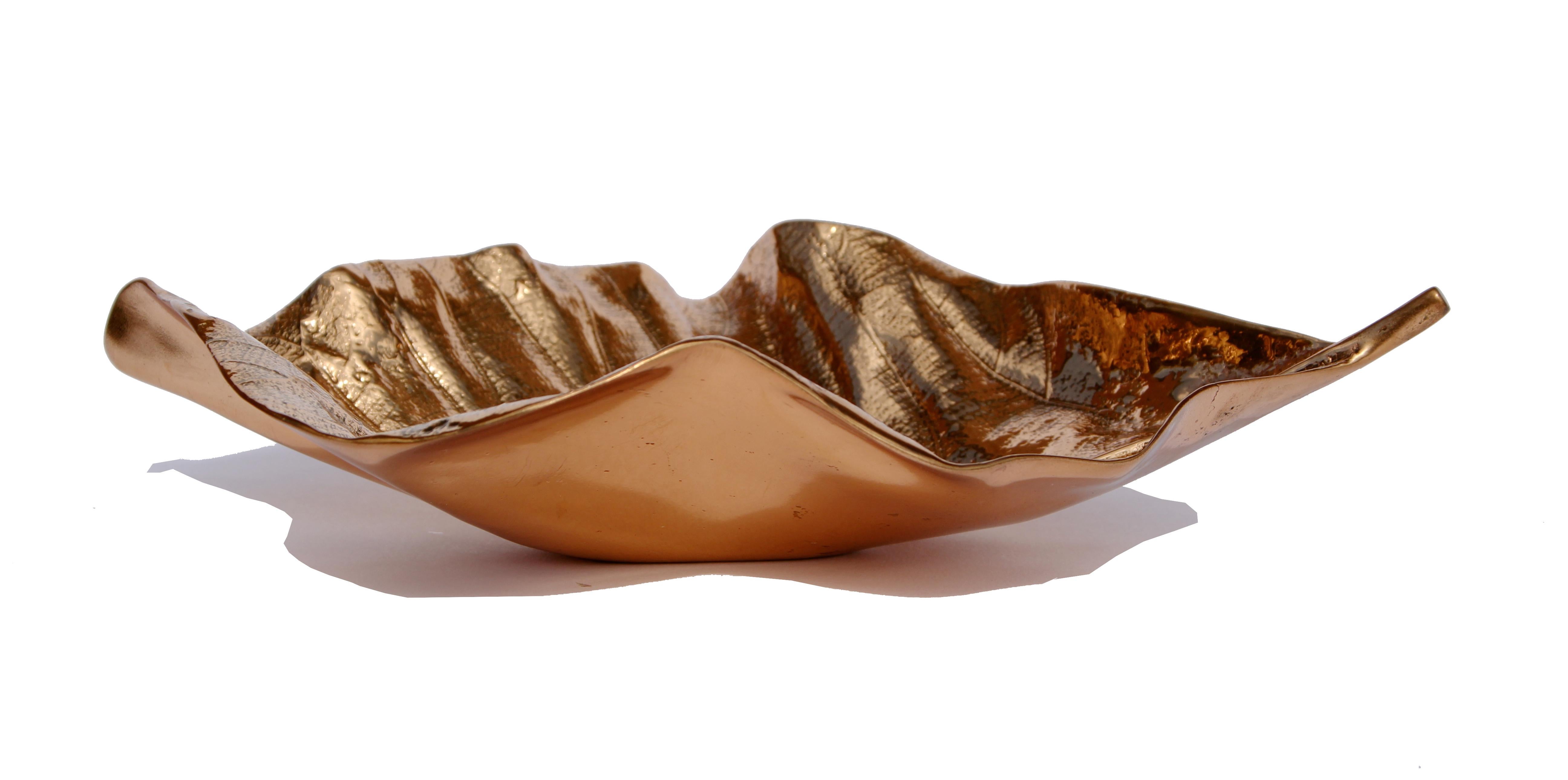 Elegant handmade cast bronze leaf in a polished bronze finish. They may be used as a bowl or just a beautiful decorative object.

Each of these splendid leaves are handmade individually with incredible detail. Cast using very traditional techniques,