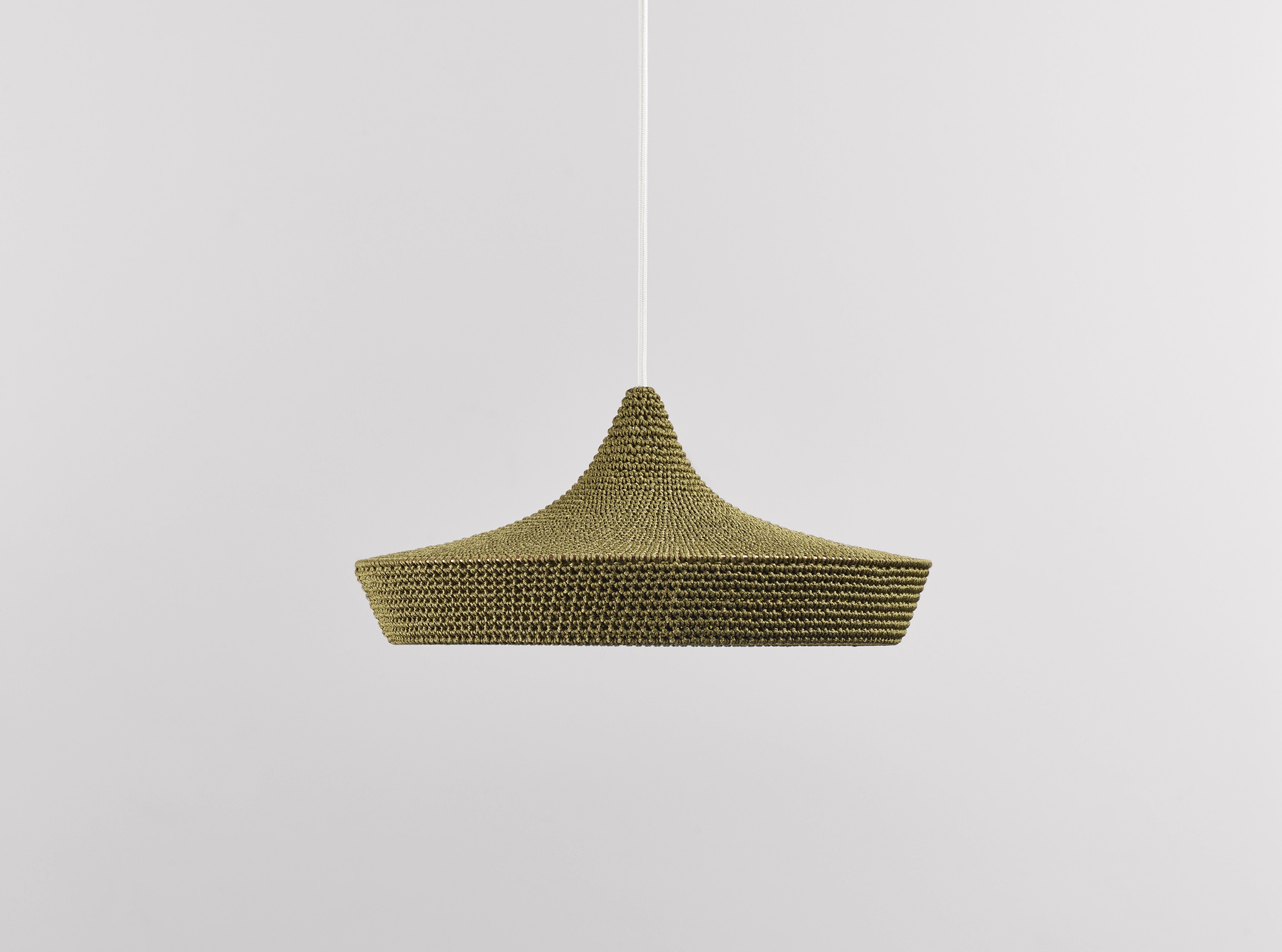Medium cave pendant lamp by Naomi Paul
Dimensions: D 50 x H 24 cm
Materials: Metal frame, Egyptian cotton cord.
Color: Olive and green gold inside edge.
Available in other colors and in 4 sizes: D30, D40, D50, D60 cm.
Available in Inside edge