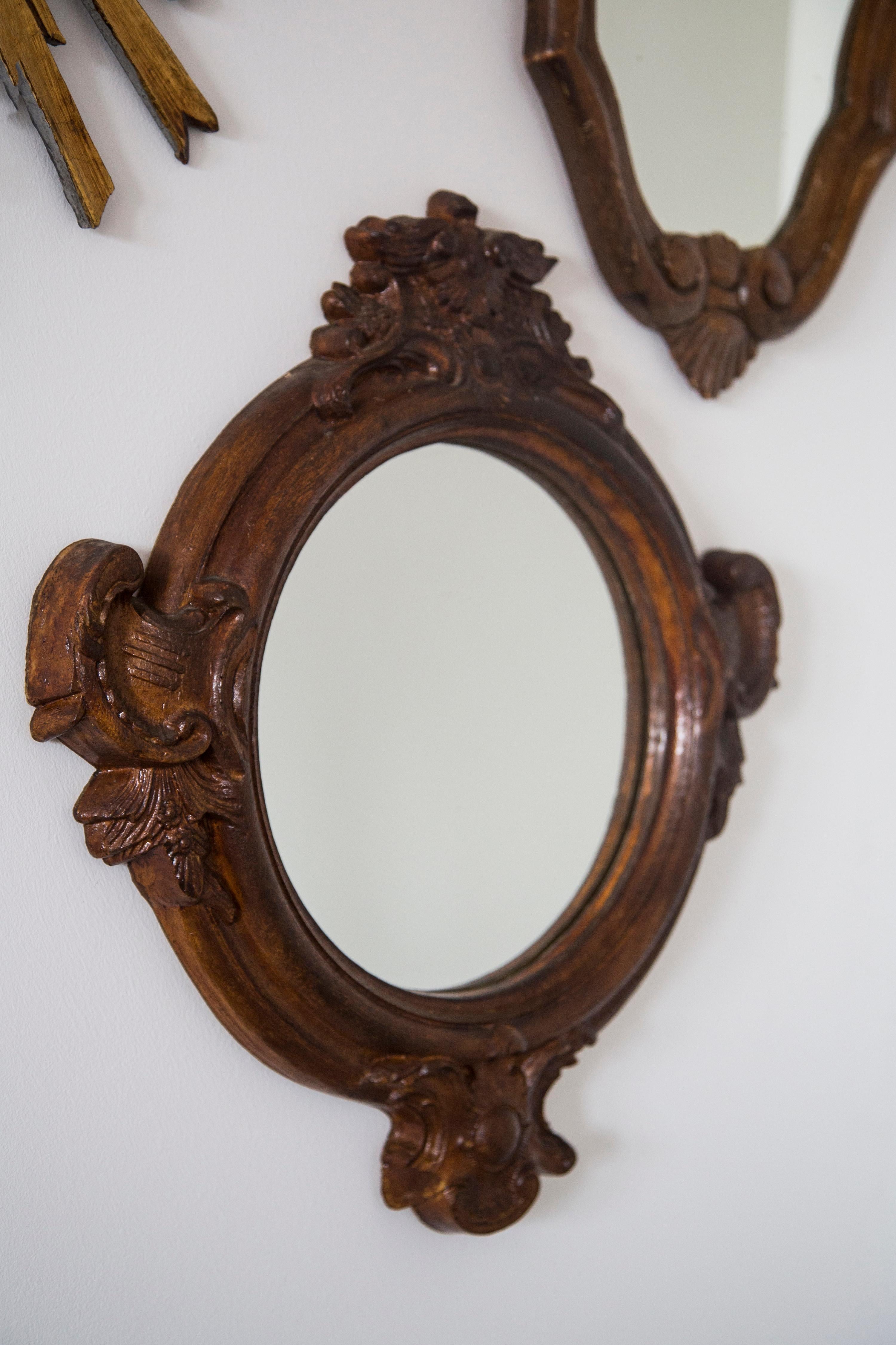 Beautiful mirror in a brown decorative frame from Europe. The frame is made of polywood. Mirror is in very good vintage condition. Original glass. 
Beautiful piece for every interior! Only one unique piece.