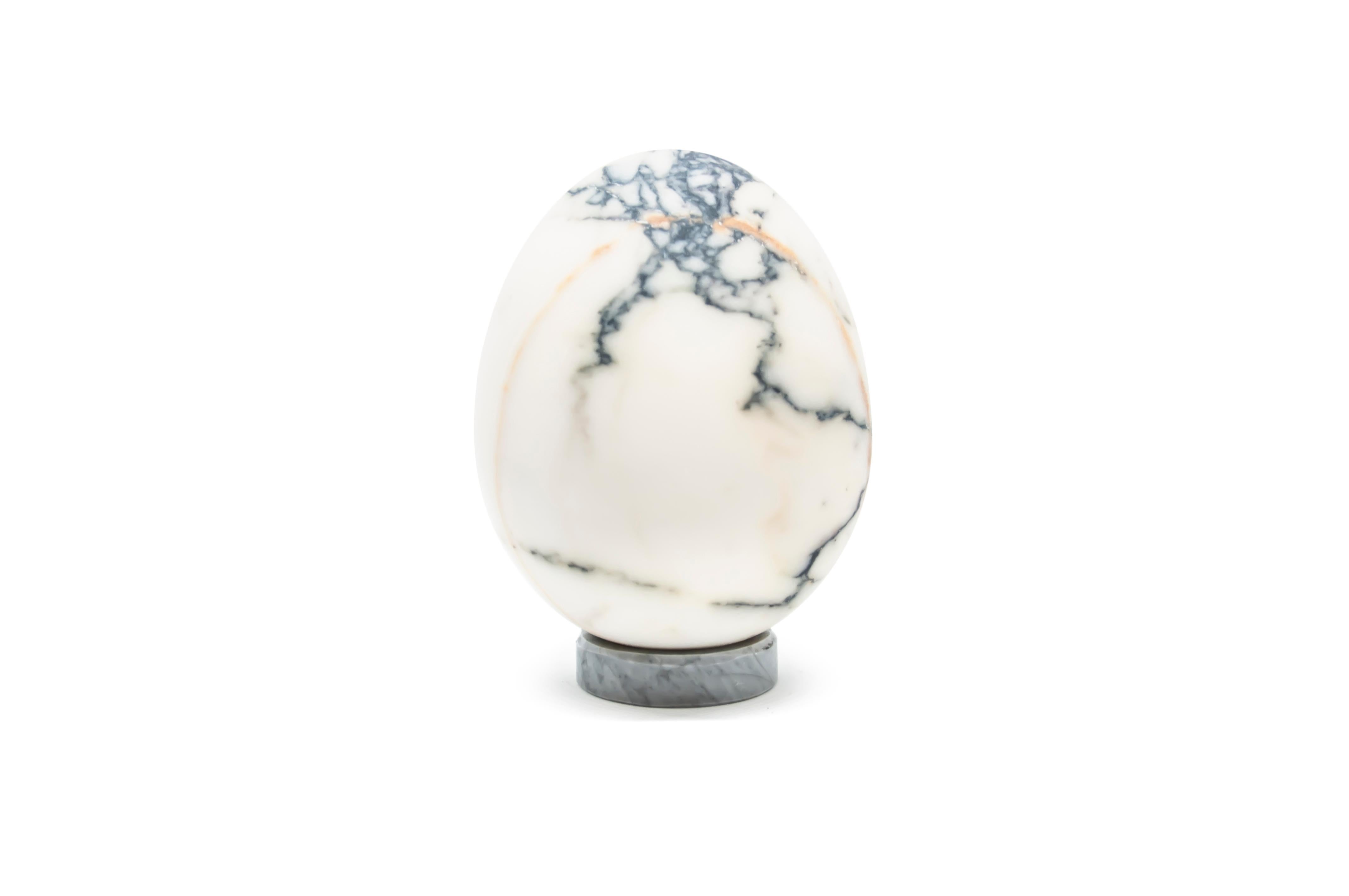 Decorative full medium egg in Paonazzo marble (base included). Each piece is in a way unique (every marble block is different in veins and shades) and handmade by Italian artisans specialized over generations in processing marble. Slight variations