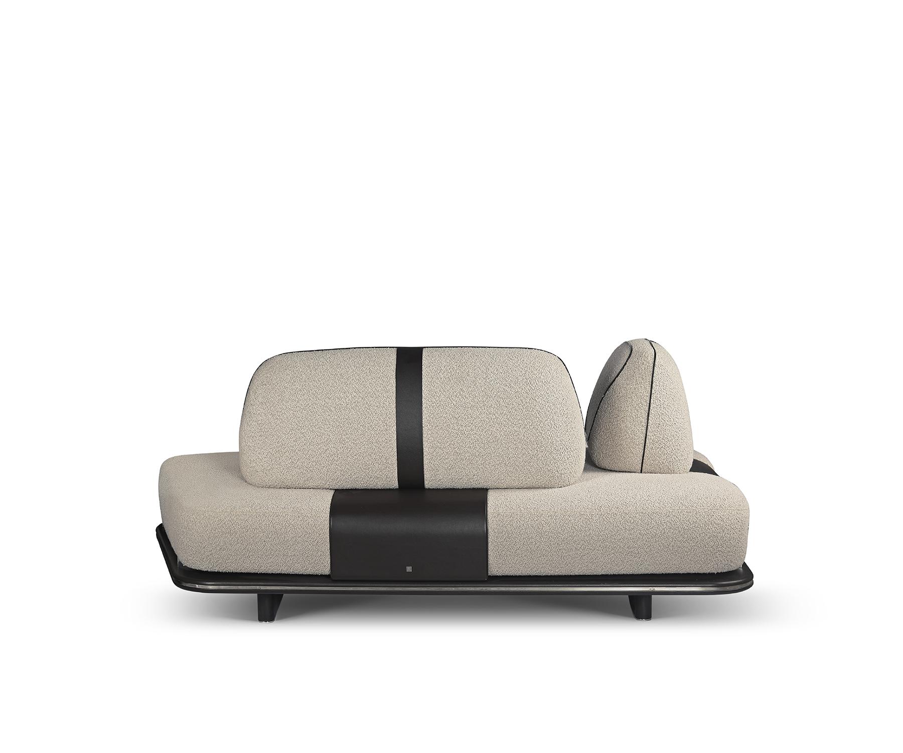 The Field sofa captures the beauty of natural forms, inspired by the Dialogue collection’s exploration of organic shapes and landscapes.

Its textured upholstery pairs elegantly with leather accents, resting on a sleek, low-profile metal base