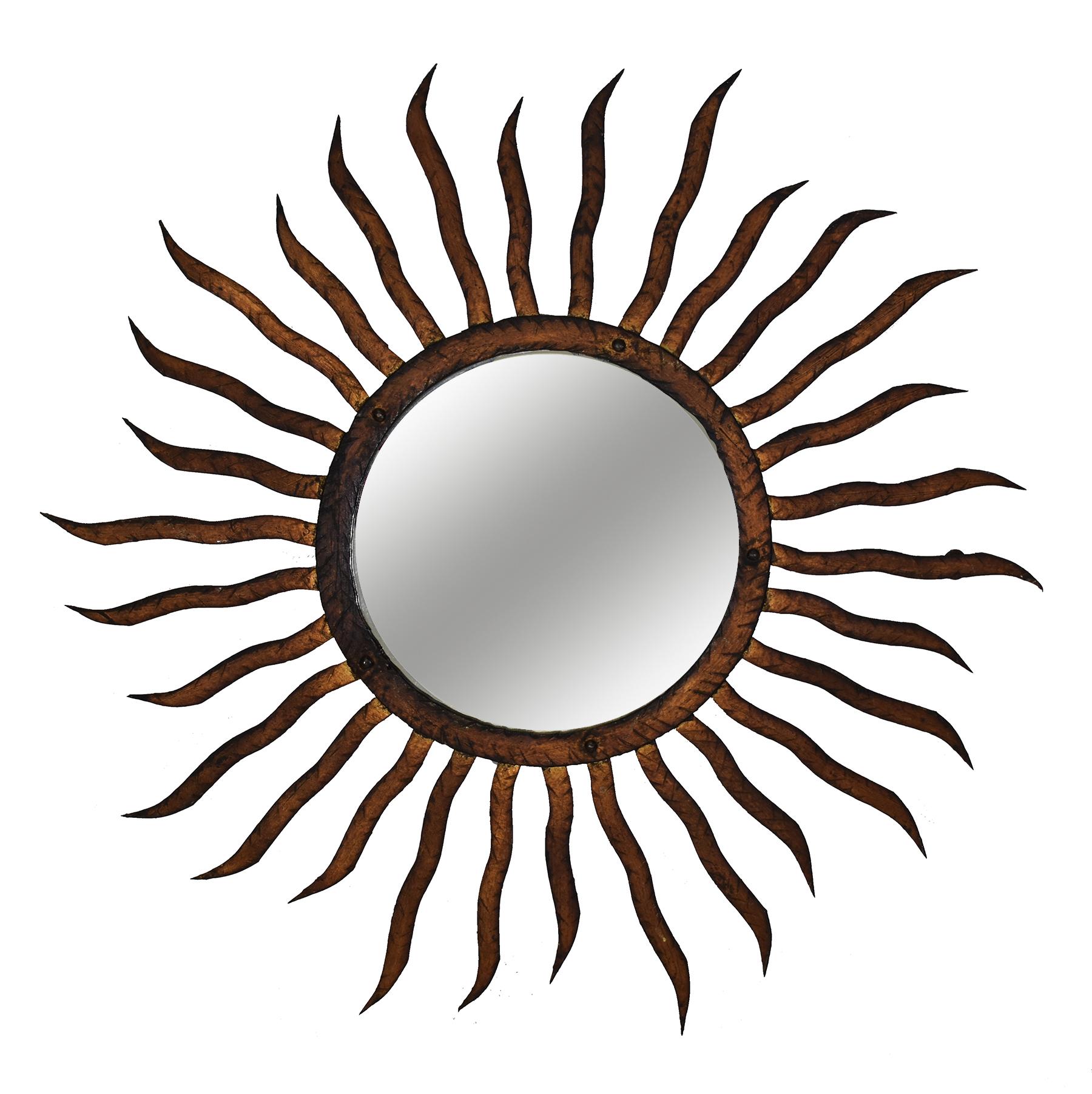This medium-sized vintage gilded iron sun mirror is a dramatic accent piece in any room. Brings extra light to a space.
 