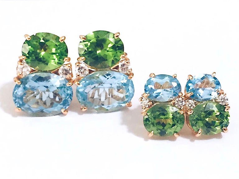 Medium 18kt Yellow gold GUM DROP™ earrings with Blue Topaz(approximately 2.5 cts each), Peridot (approximately 5 cts each), and 4 diamonds weighing ~0.40 cts.

Finished with an omega clip back for Clip or Pierced Ears.

The Earrings  can be made in