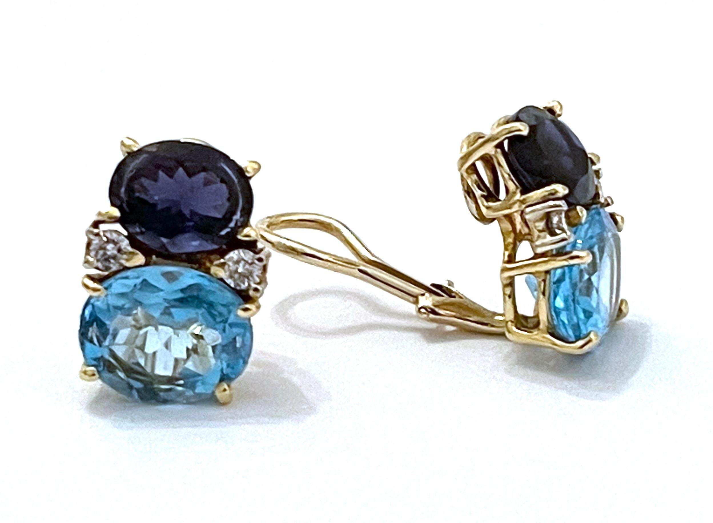 Medium 18kt White gold GUM DROP™ earrings with Iolite (approximately 2.5 cts each), Blue Topaz (approximately 5 cts each), and 4 diamonds weighing ~0.40 cts.

They can be made in ANY color stone combination that you would like!
Please contact us