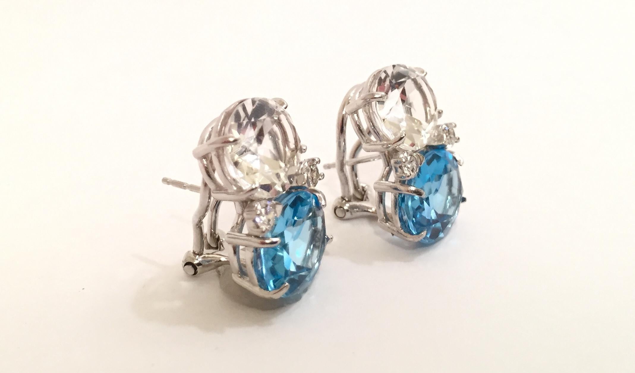 18kt Medium White Gold GUM DROP™ Earrings with Rock Crystal and Blue Topaz and four Diamonds.

The Medium 18kt White Gold GUM DROP™ earrings host faceted oval Rock Crystal (approximately 2.5 cts each) and Blue Topaz (approximately 5 cts each) and 4
