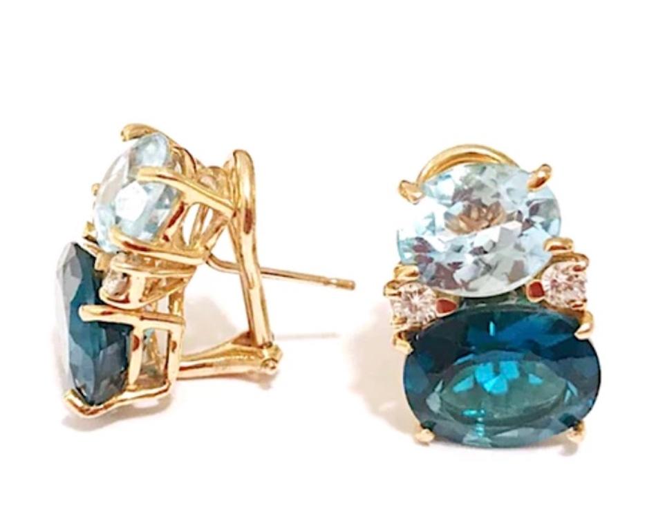 Medium 18kt yellow gold GUM DROP™ earrings with iolite (approximately 2.5 cts each), faceted blue topaz (approximately 5 cts each), and 4 diamonds weighing 0.40 cts.

Specifications: Height: 3/4