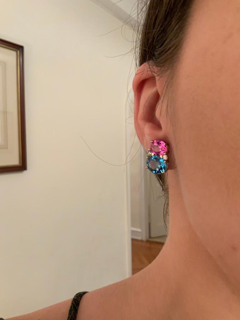 Christina Addison Medium 18kt yellow gold GUM DROP™ earrings with faceted Peridot  (approximately 2.5 cts each), faceted Pink Topaz  (approximately 5 cts each), and 4 diamonds weighing ~0.40 cts. 

Specifications: Height: 3/4
