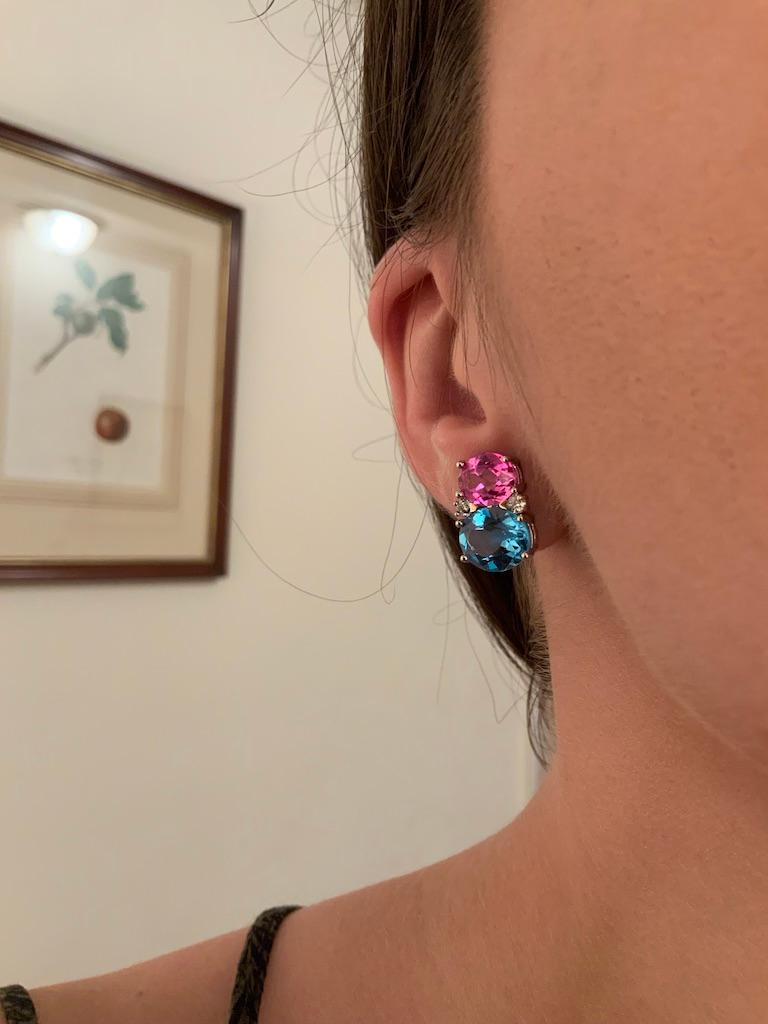 Medium 18kt White gold GUM DROP™ earrings with pink topaz (approximately 2.5 cts each), Blue Topaz (approximately 5 cts each), and 4 diamonds weighing 0.40 cts.

Specifications: Height: 3/4