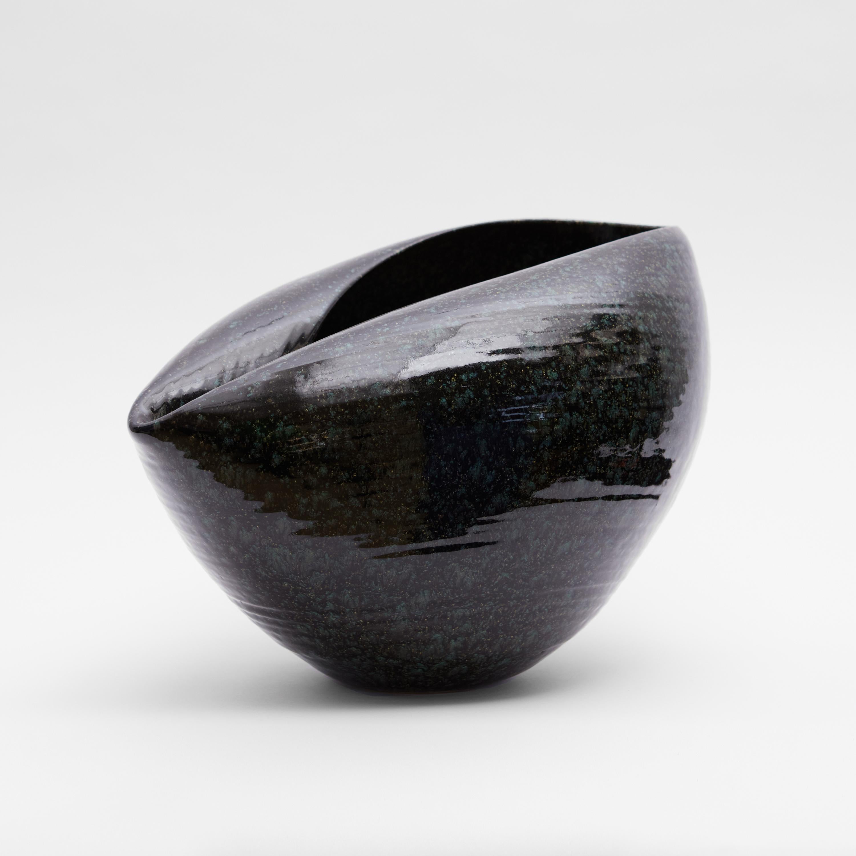 Vessel from ceramic artist Nicholas Arroyave-Portela.

No. 106 Large black cosmic open form (Vessel, Interior sculpture, not suitable for holding water)

White St.Thomas clay, Stoneware glazes, multi fired to cone 6 (1223 degrees)

Made in 2023
26