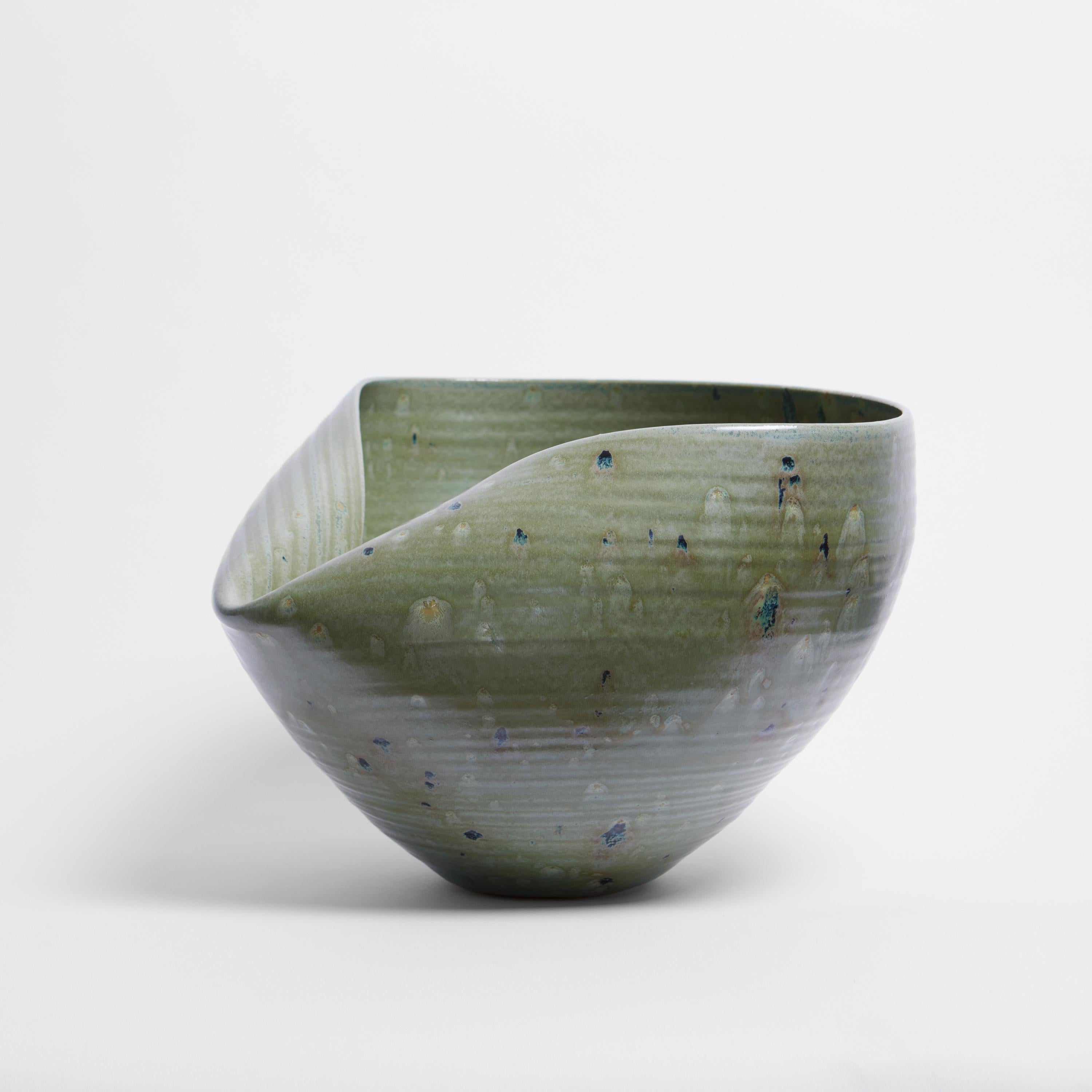 Vessel from ceramic artist Nicholas Arroyave-Portela.

No. 104 Medium large green collapsed open form (Vessel, Interior sculpture, not suitable for holding water)

White St.Thomas clay, Stoneware glazes, multi fired to cone 6 (1223 degrees)

Made in