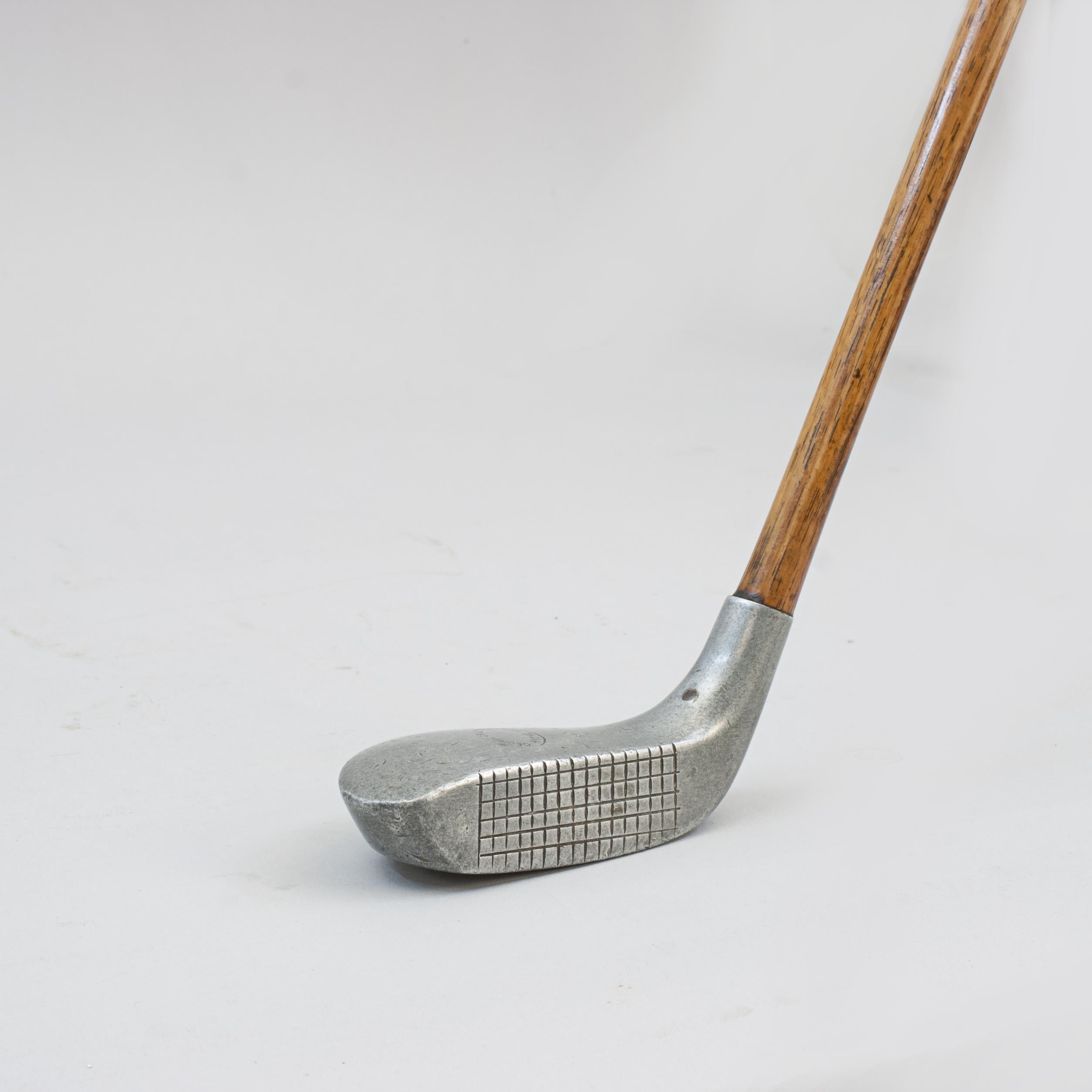 Vintage Hickory Golf Club, Braid Mills Style Putter.
A good example of an aluminium Braid Mills style putter by George Cribben, Hythe Golf Club, Kent (1897 - 1917). The top of the head is stamped with George's details within an oval and 'Special',