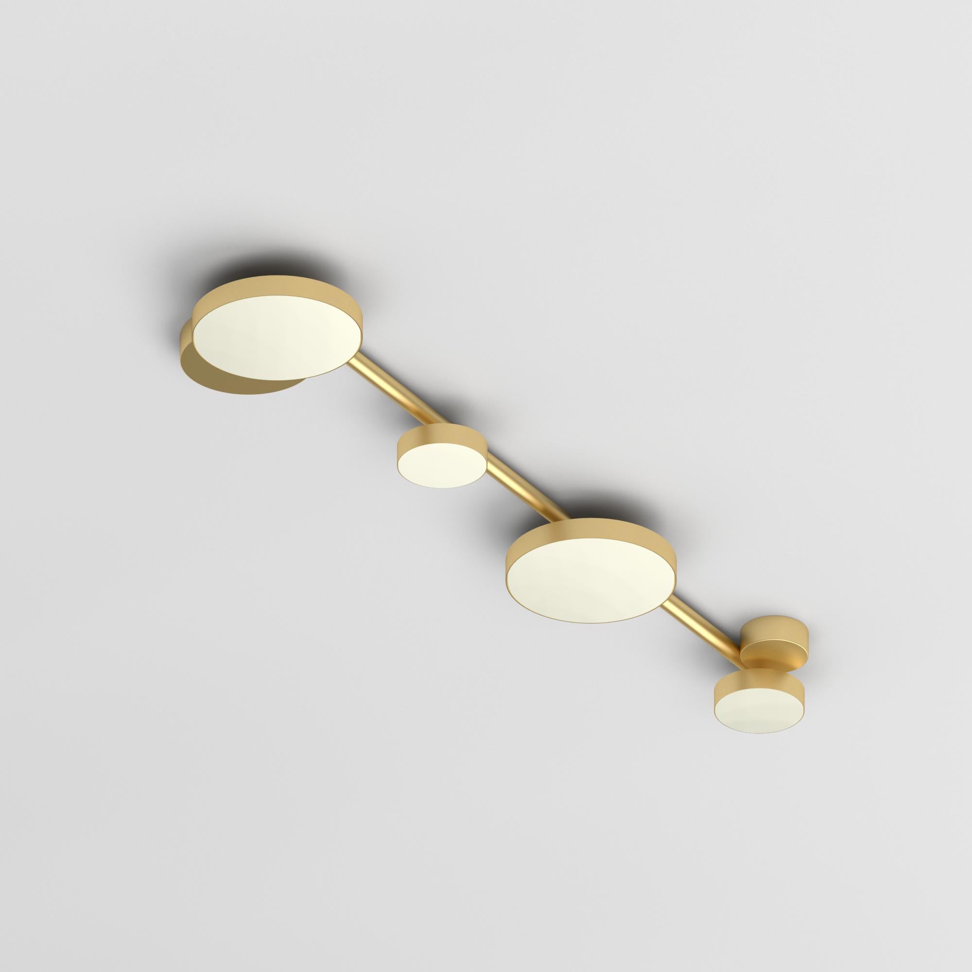 Medium Line, 4 Circles, Ceiling Light by Atelier Areti
Dimensions: D 20 x W 89.5 x H 6 cm.
Materials: Brushed brass, white glass.

All our lamps can be wired according to each country. If sold to the USA it will be wired for the USA for