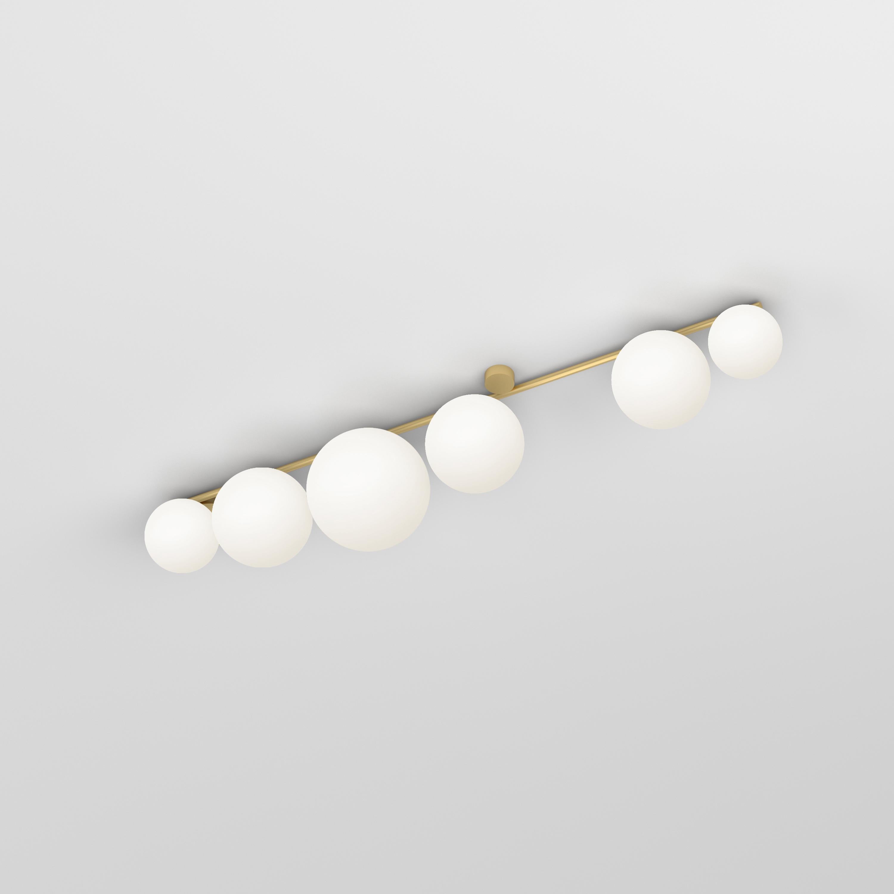 Medium Line, 6 Globes, Ceiling Light by Atelier Areti
Dimensions: D 25 x W 143 x H 28.8 cm.
Materials: Brushed brass, white glass.

All our lamps can be wired according to each country. If sold to the USA it will be wired for the USA for