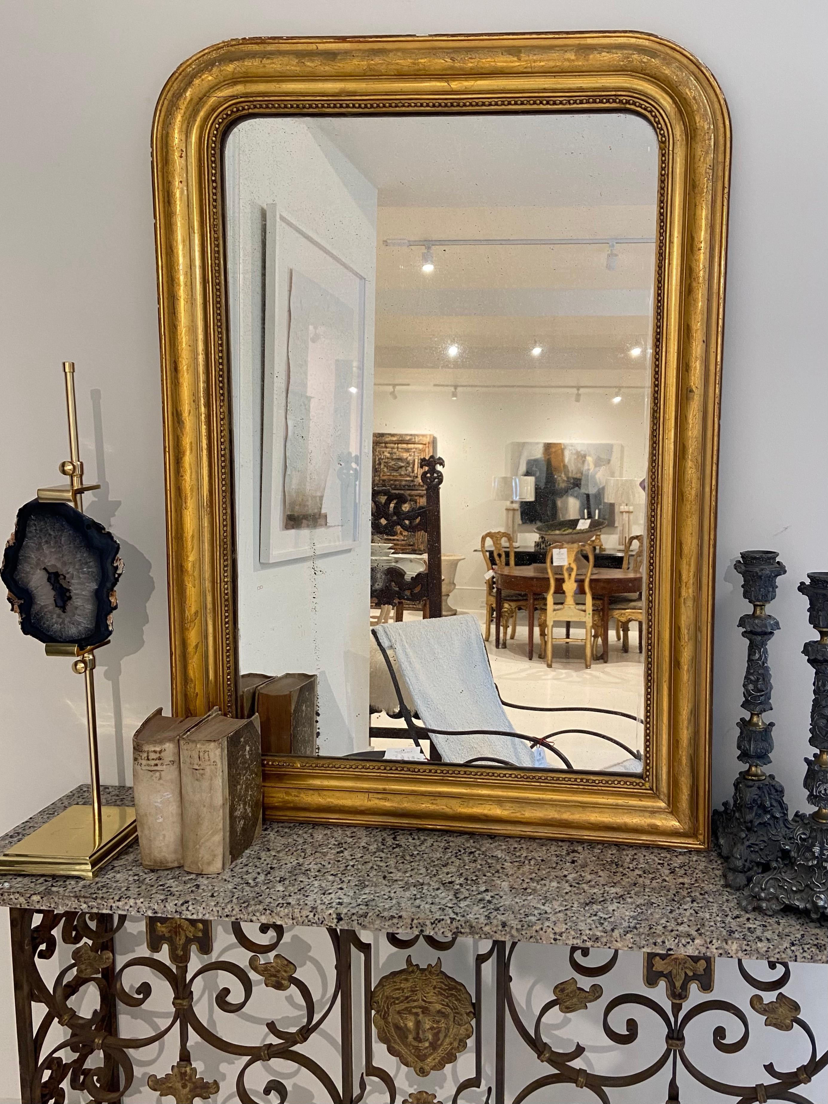 Stunning Louis Philippe Gilded Mirror would be a lovely addition to any room. 