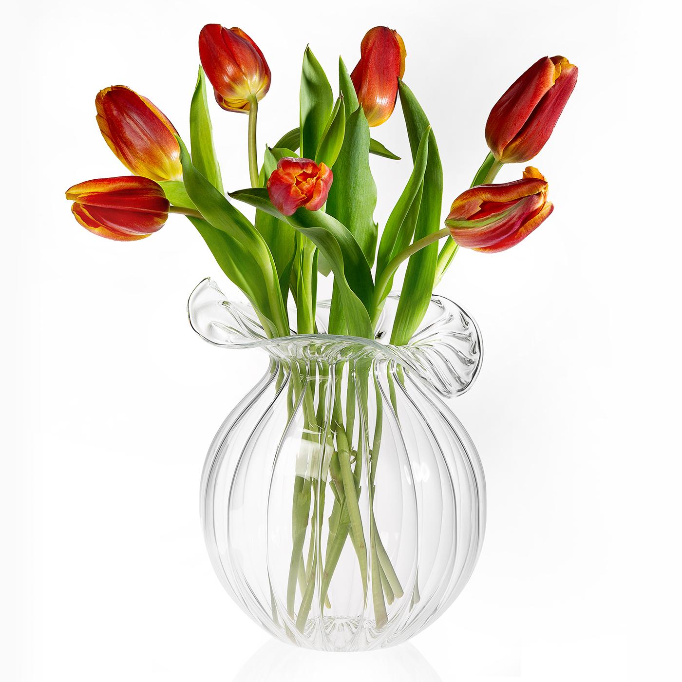 The Medium Millerighe Round vase is a stunning example of Italian artistry, featuring a sinuous silhouette complemented by a distinctive striped surface. This piece captures the essence of traditional Venetian design, with its 'Millerighe' pattern