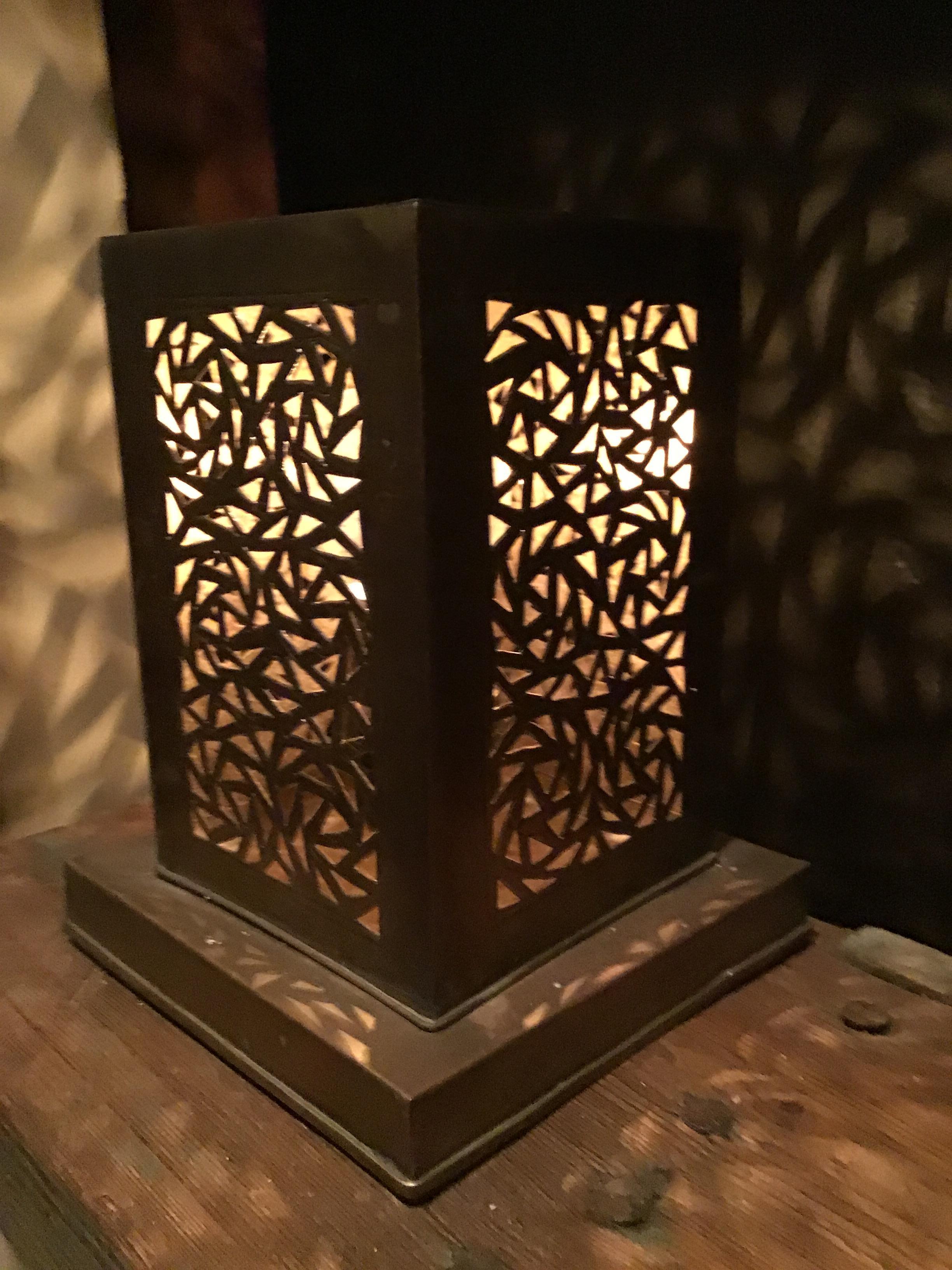 Beautifully detailed brass table lamp in a modern geometric shape.