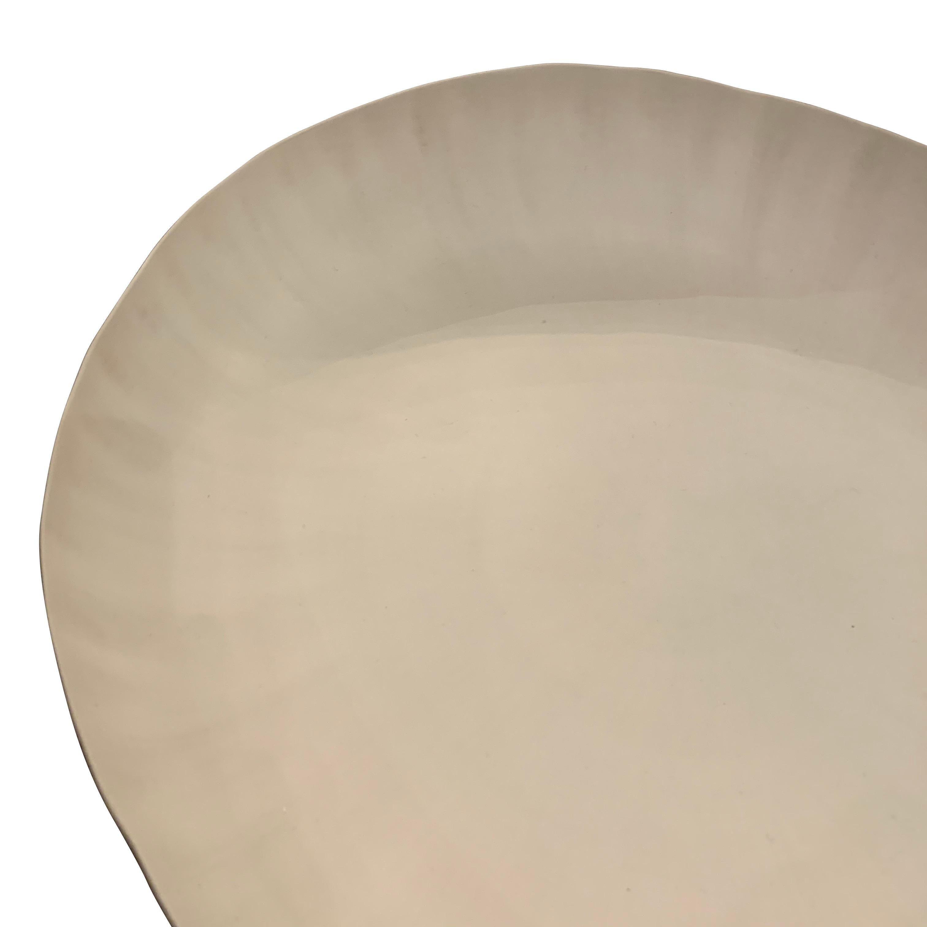 Contemporary handmade fine ceramic white round bowl with subtle shadow decorative glaze
