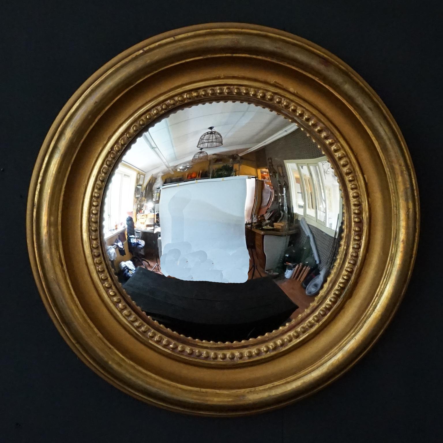 Perfect vintage wall decoration.
Medium size round convex mirrors in relief pearled plastered gilt wood frames. 
Great addition to any wall and impactful statement on its own.
Imagine this in your hallway, bathroom or in a collection of vintage