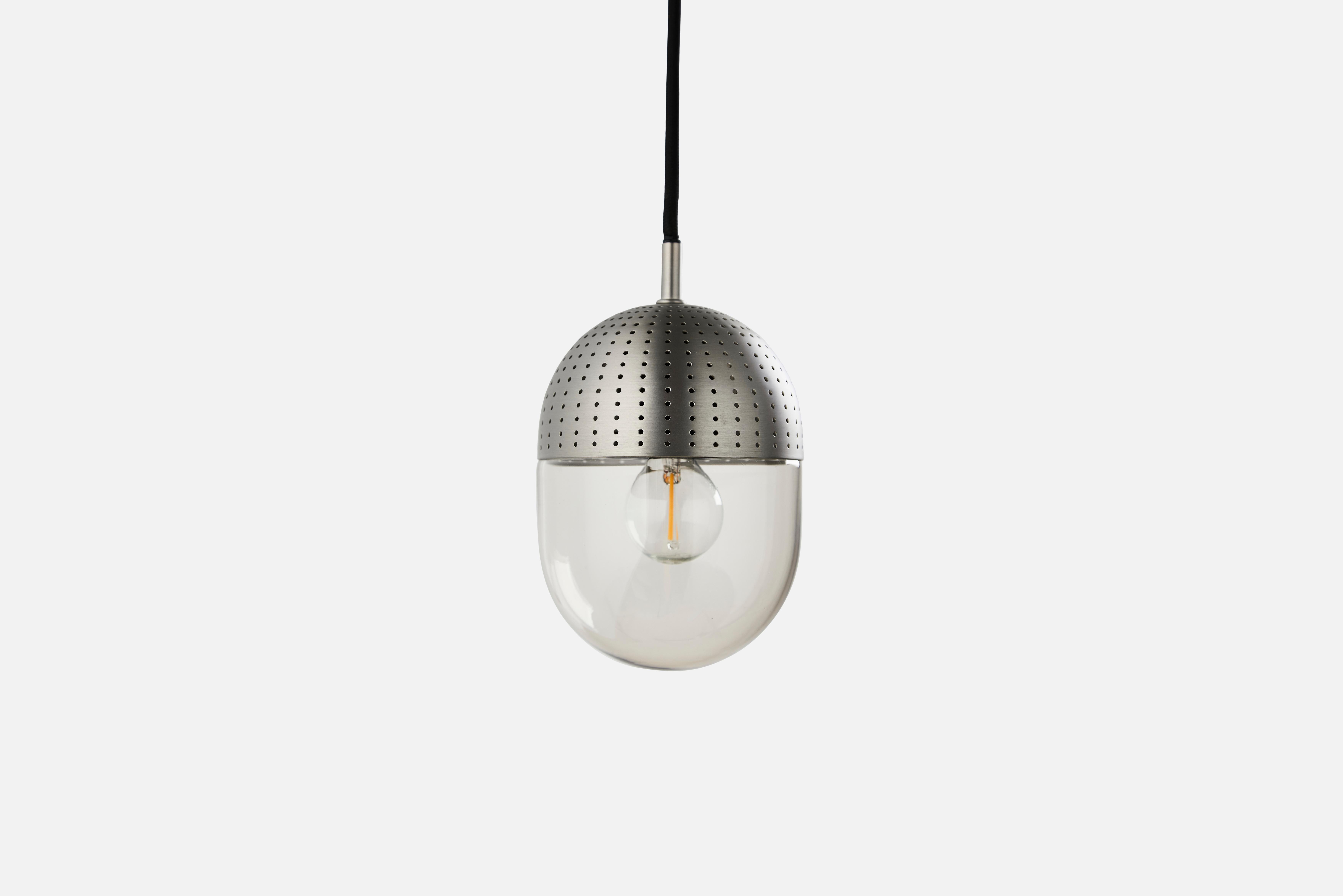 Medium Satin dot pendant lamp by Rikke Frost
Materials: Metal, glass.
Dimensions: D 14 x H 16.6 cm
Available in black or satin and in 3 sizes: H 13, H 16.6, H 21 cm.

Rikke Frost is a Danish graduate from the School of Architecture Aarhus.