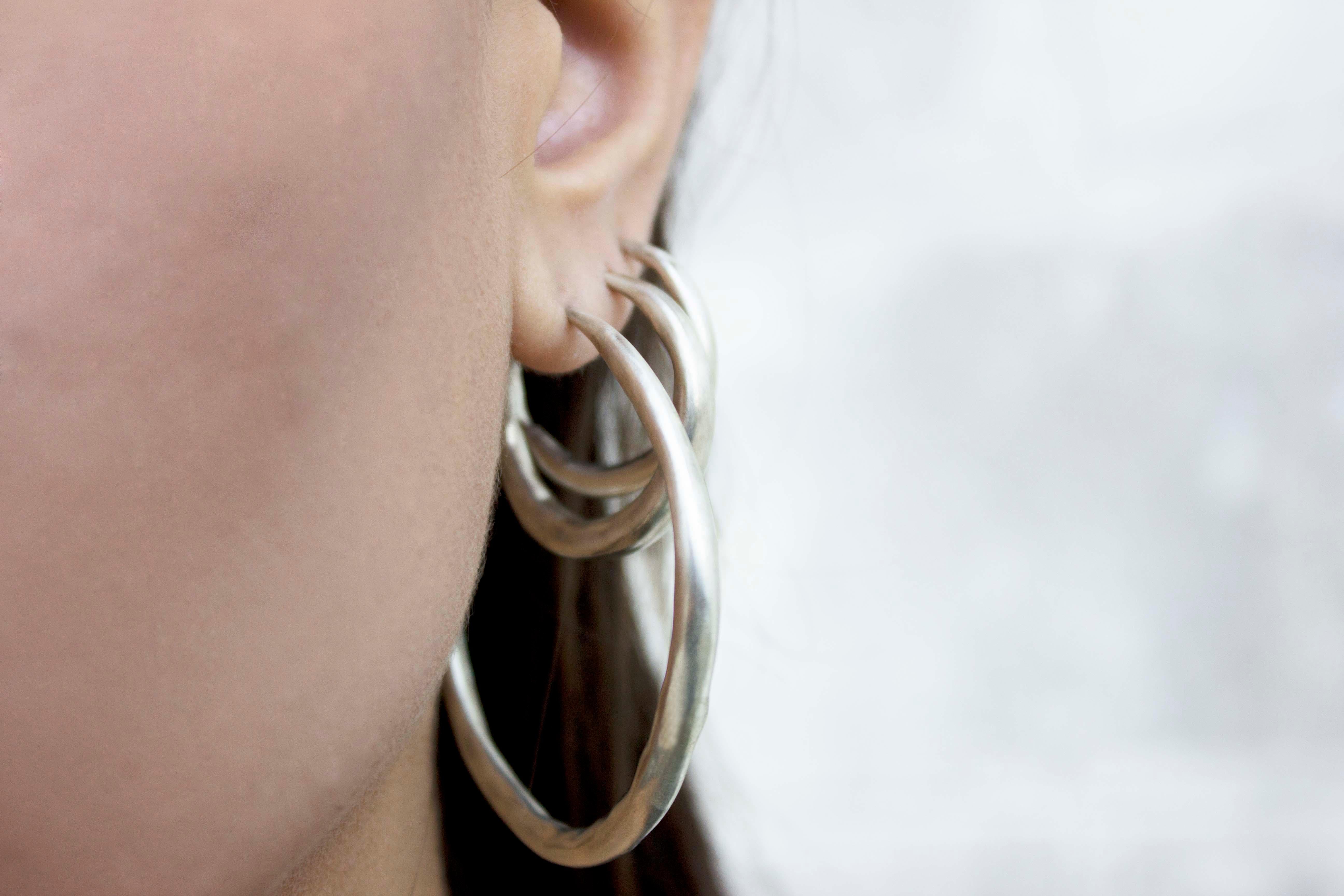 Medium Silver Hoop Earrings

They are made from handmade chenier, a fine, hollow tube which is lightweight.

Each piece is unique and therefore slightly different , even the ones that come in pairs.

I usually make them in four sizes, small, medium,