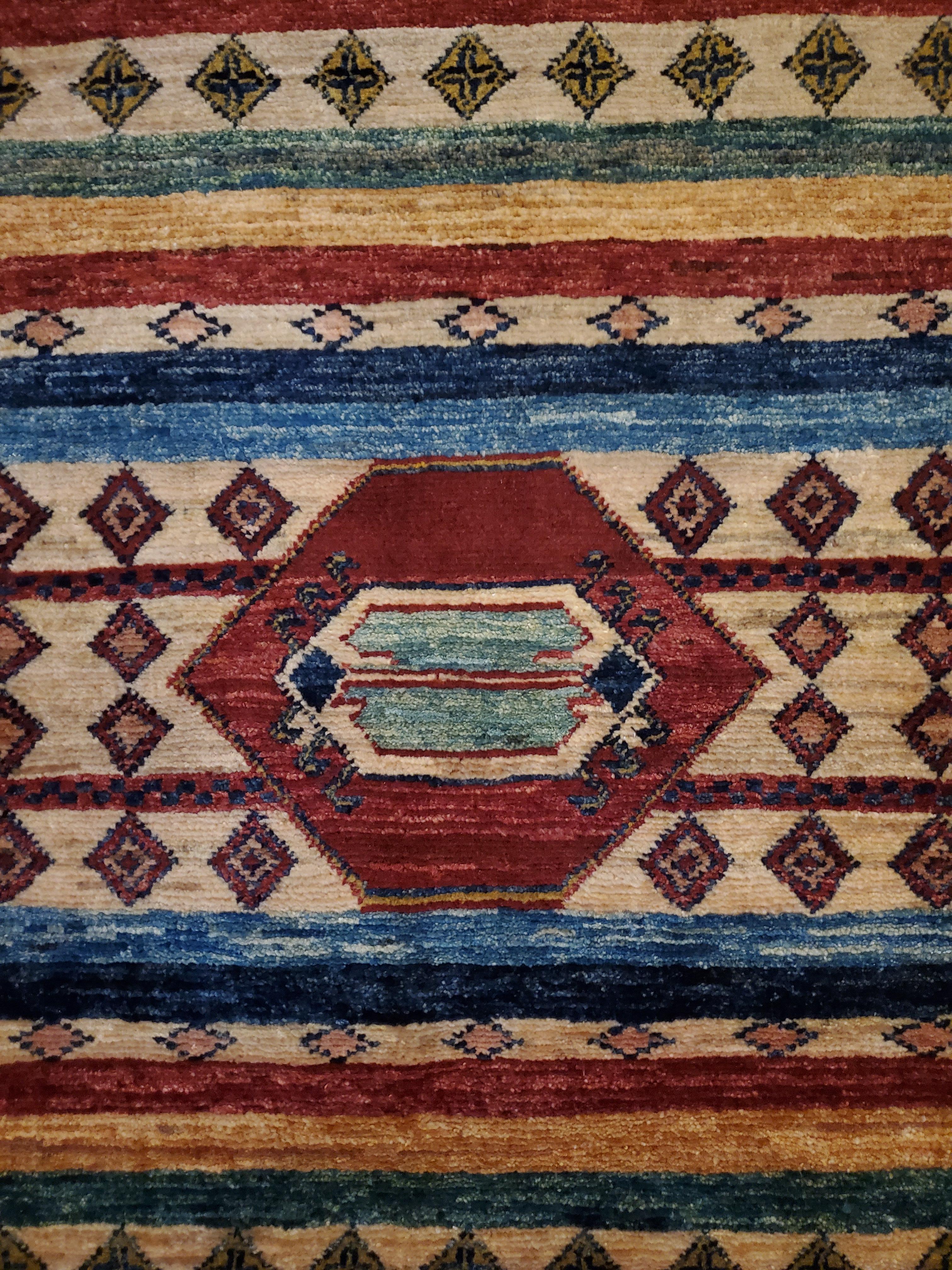We carry some of the best Afghan bedside rugs, and if you are willing to give your space a colorful new look with one of our stunning carpets, we are here to help. This one measures approximately 39