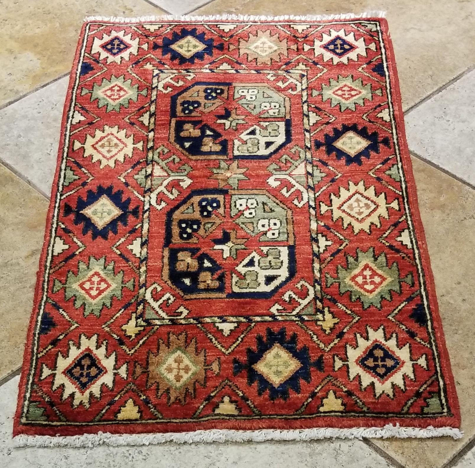 We carry some of the best Afghan bedside rugs, and if you are willing to give your bedroom a colorful new looks with one of our stunning carpets, we are here to help. This one measures approximately 38