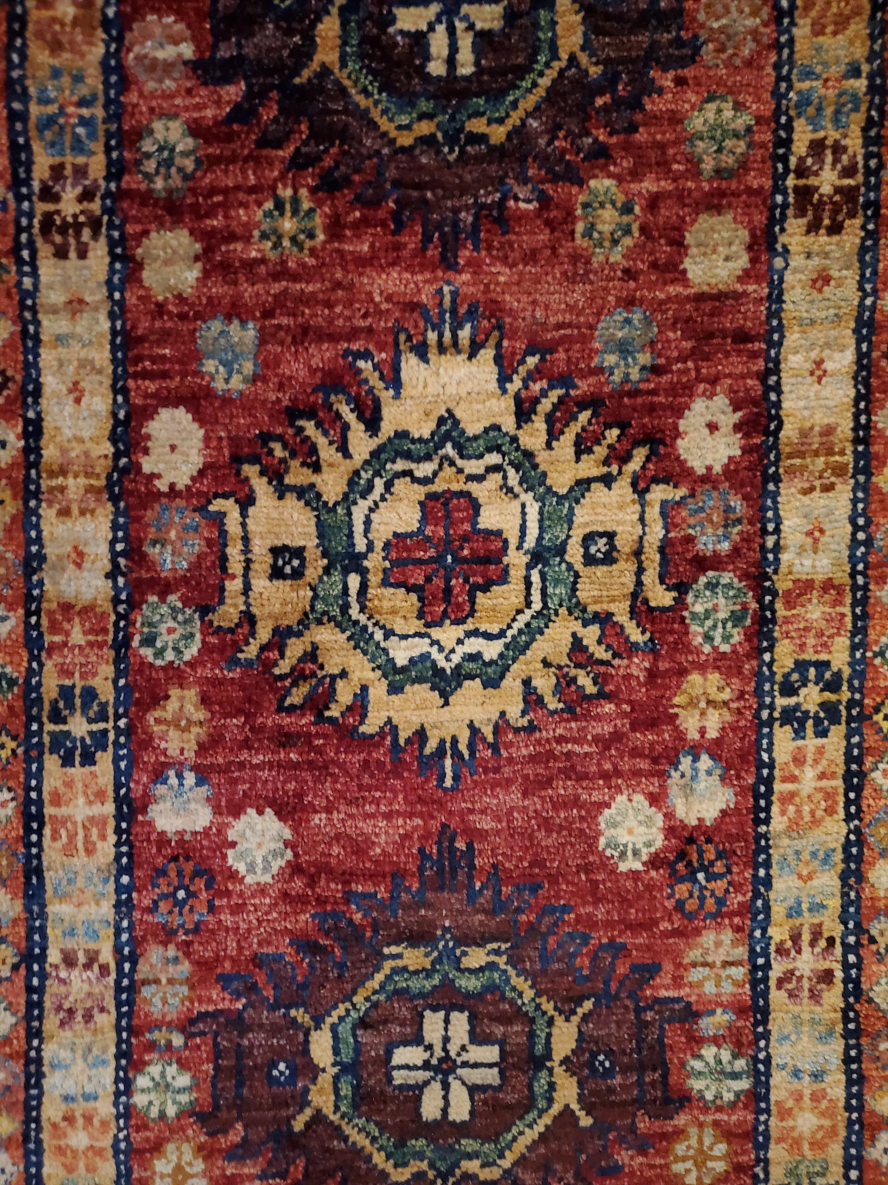 We carry some of the best Afghan bedside rugs, and if you are willing to give your space a colorful new look with one of our stunning carpets, we are here to help. This one measures approximately 40