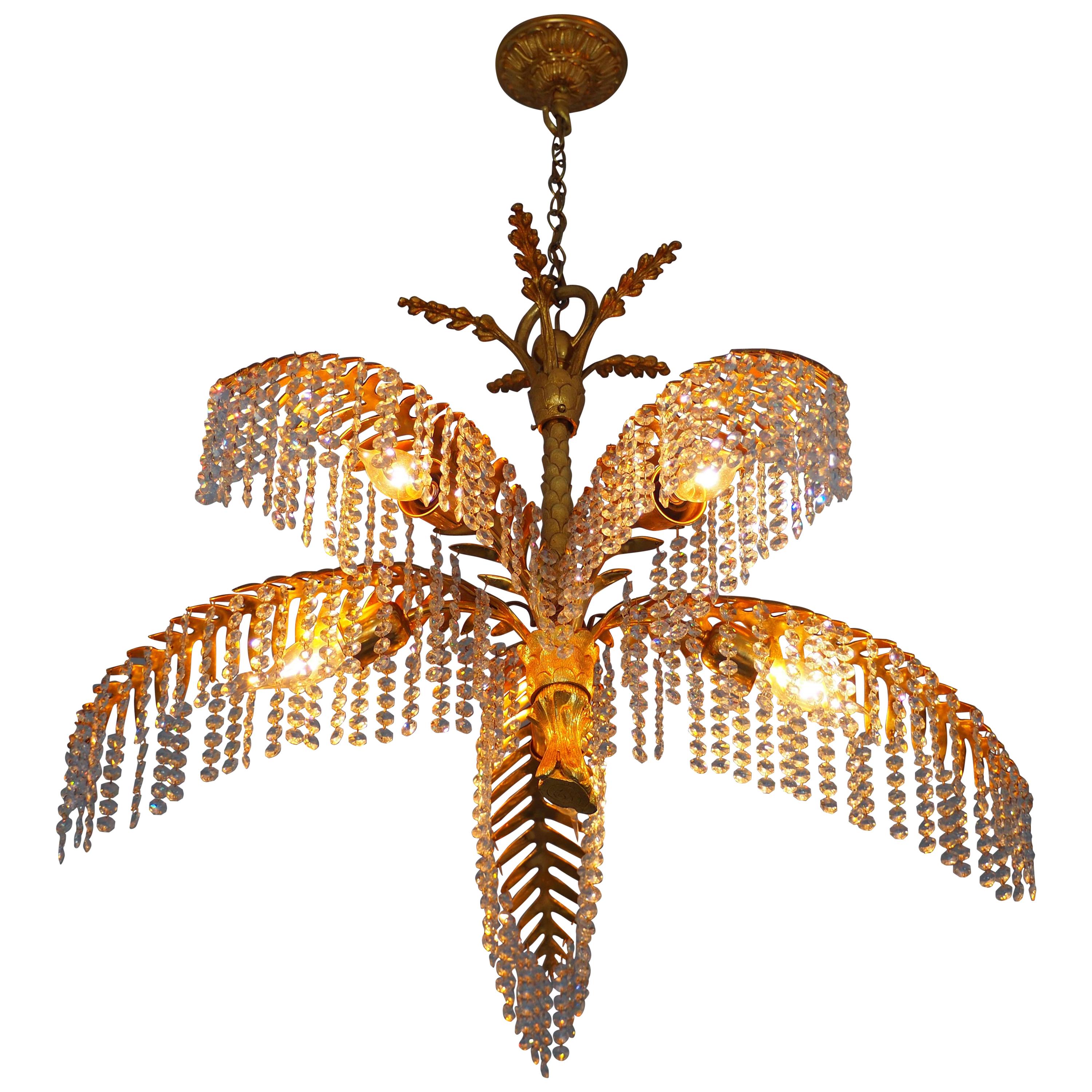 Wonderful and rare 24-carat gold-plated bronze and crystal palm tree chandelier by Bakalowits, Austria, circa 1970s.
This amazing fixture is made of gilt solid bronze frame and cut crystal (Swarovski) in the midcentury
Socket: 5 x e14 (Edison) for