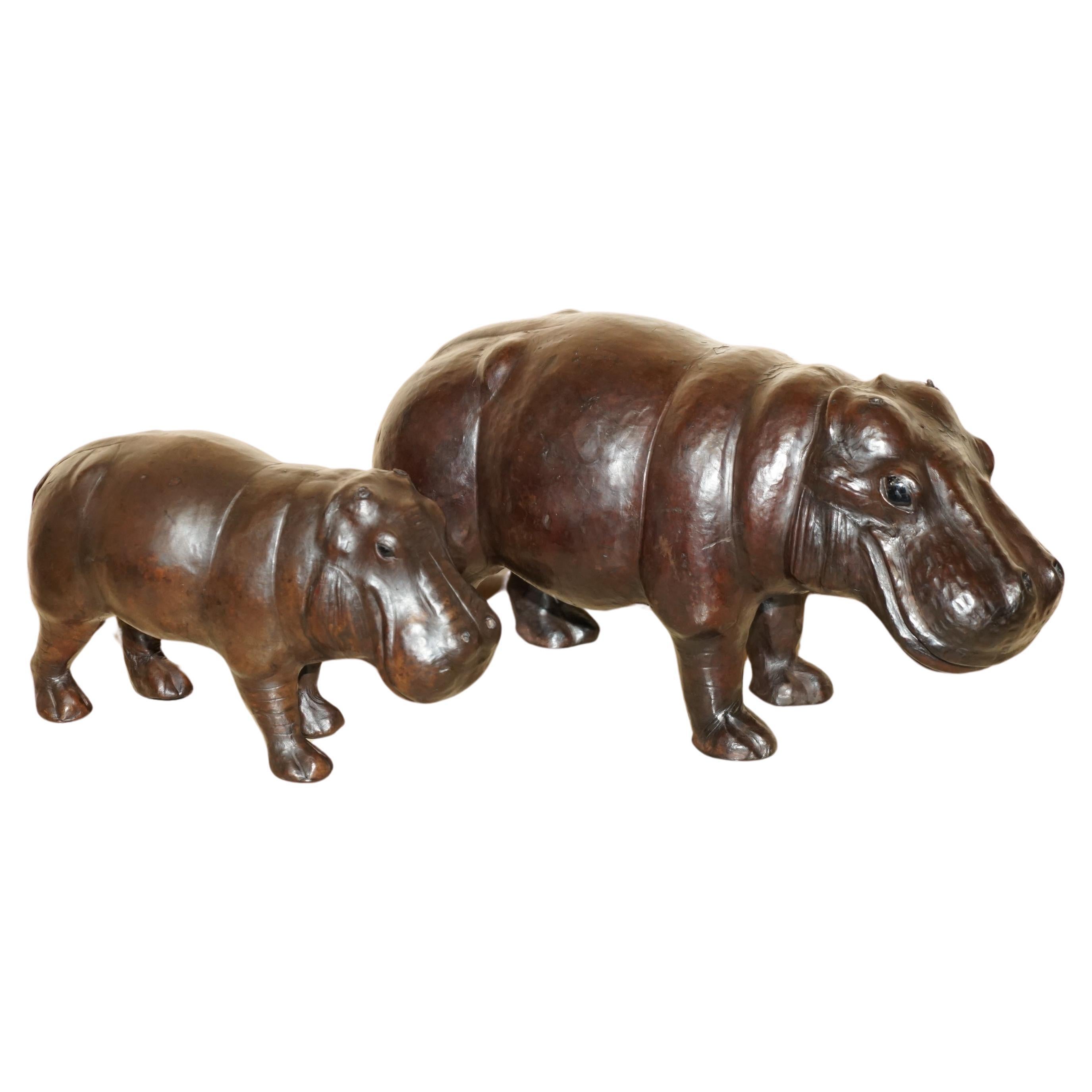 Royal House Antiques

Royal House Antiques is delighted to offer for sale this absolutely sublime very rare and original, medium sized 1930’s Liberty’s London brown leather hand dyed Hippo stool or footstool with original glass eyes and the stamp on