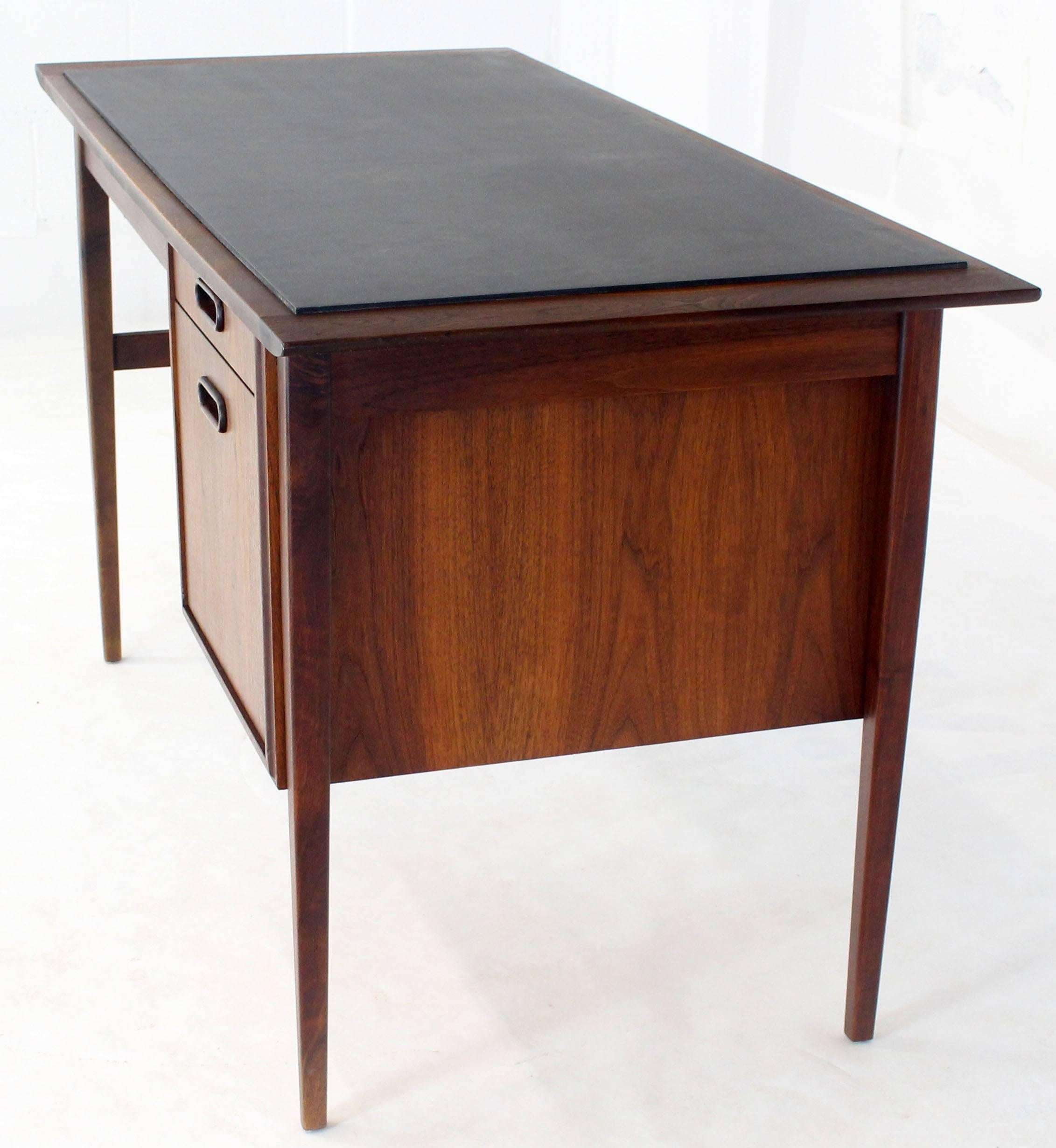 Danish Mid-Century Modern oiled walnut desk with slate top. Beautiful solid walnut tapered legs.