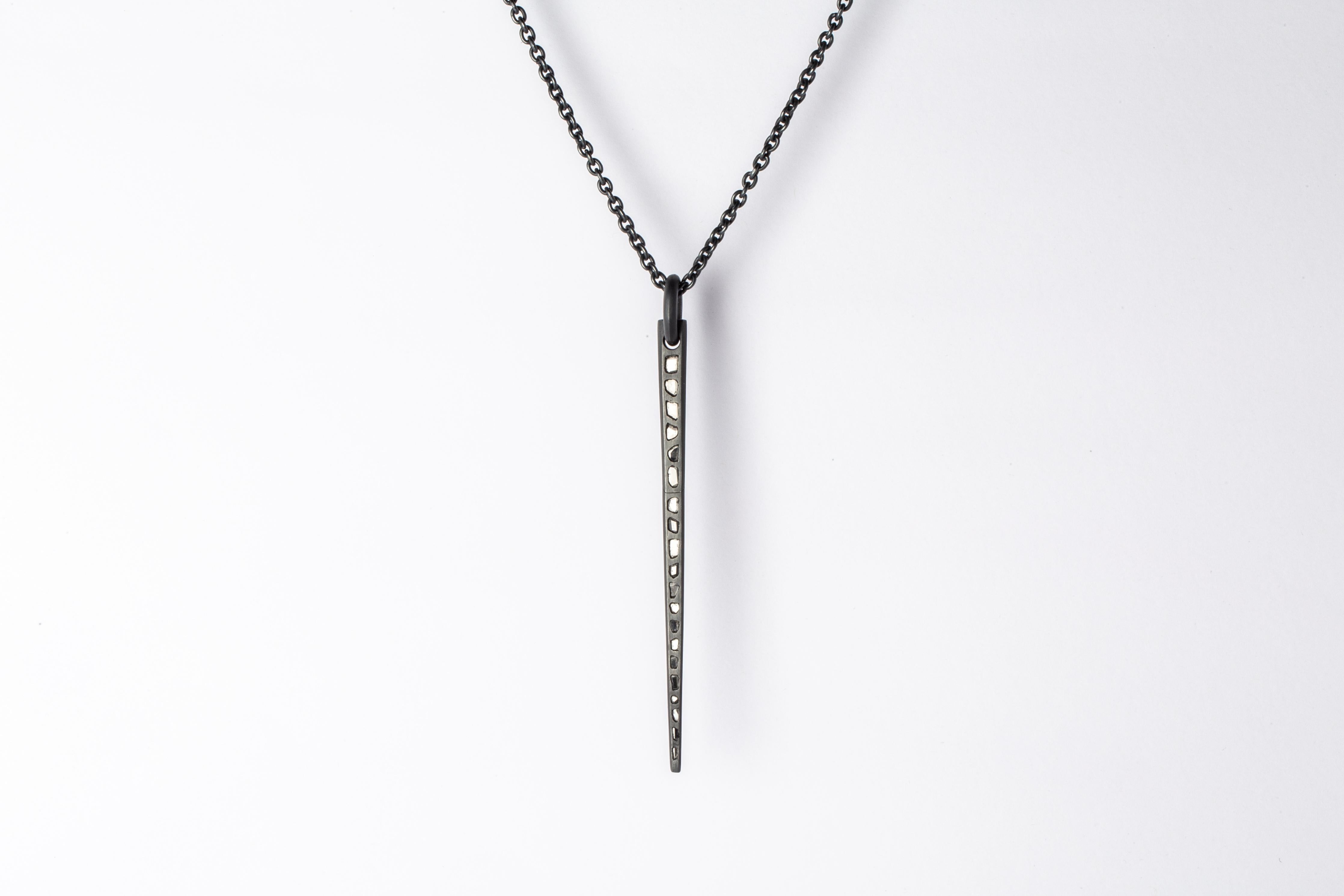 Spike necklace in oxydized sterling silver and slabs of rough diamond set in mega pave setting. It comes on a 74cm chain. These slabs are removed from a larger chunk of diamond. Each piece is unique and this is what makes it special. This finish may