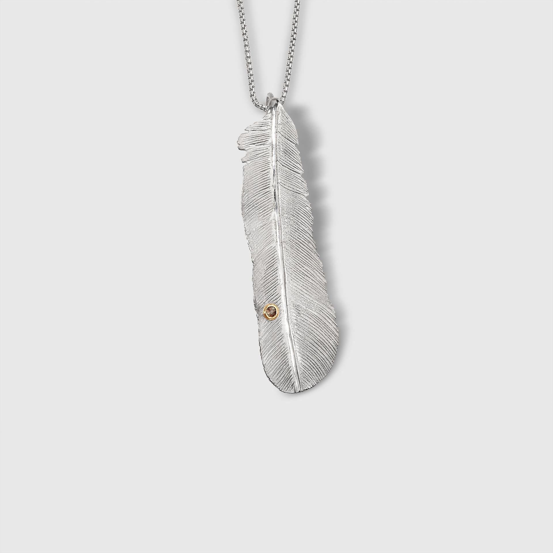 Medium Sterling Silver Detailed Feather Pendant with Andalusite detail set in 18K Yellow Gold Bezel, by Ashley Childs

This feather was originally carved by 