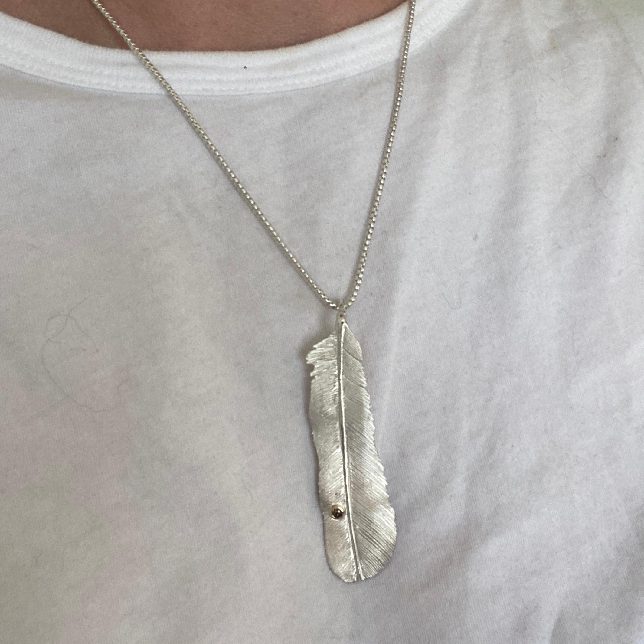 white gold feather pendant