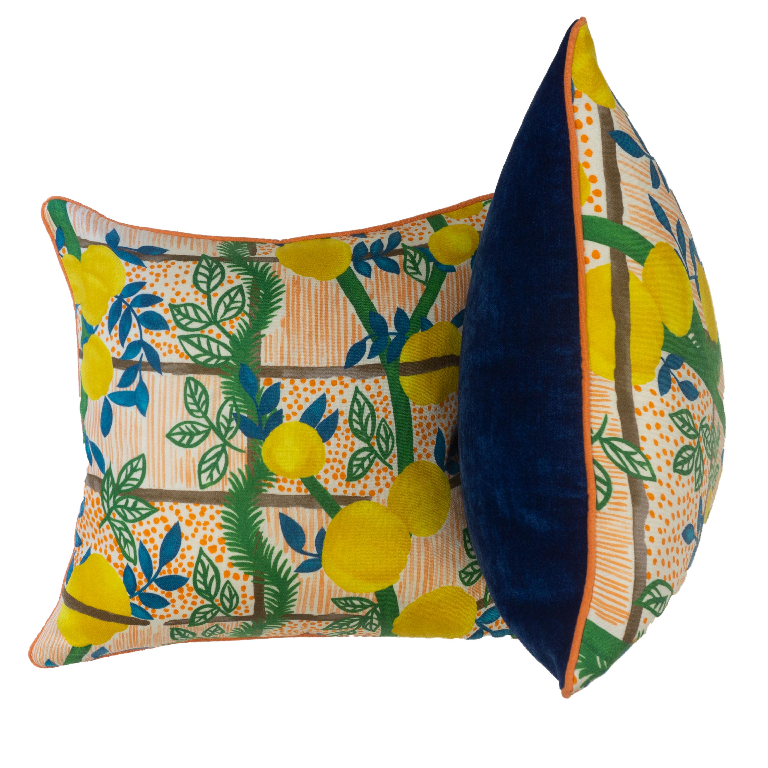 This vibrant Jim Thompson fabric features bright primary colors with a lemon tree pattern. The back is sewn in navy blue velvet bordered in orange piping.

All pillows are hand sewn at our studio in Norwalk, Connecticut. 

Measurements:

17” H