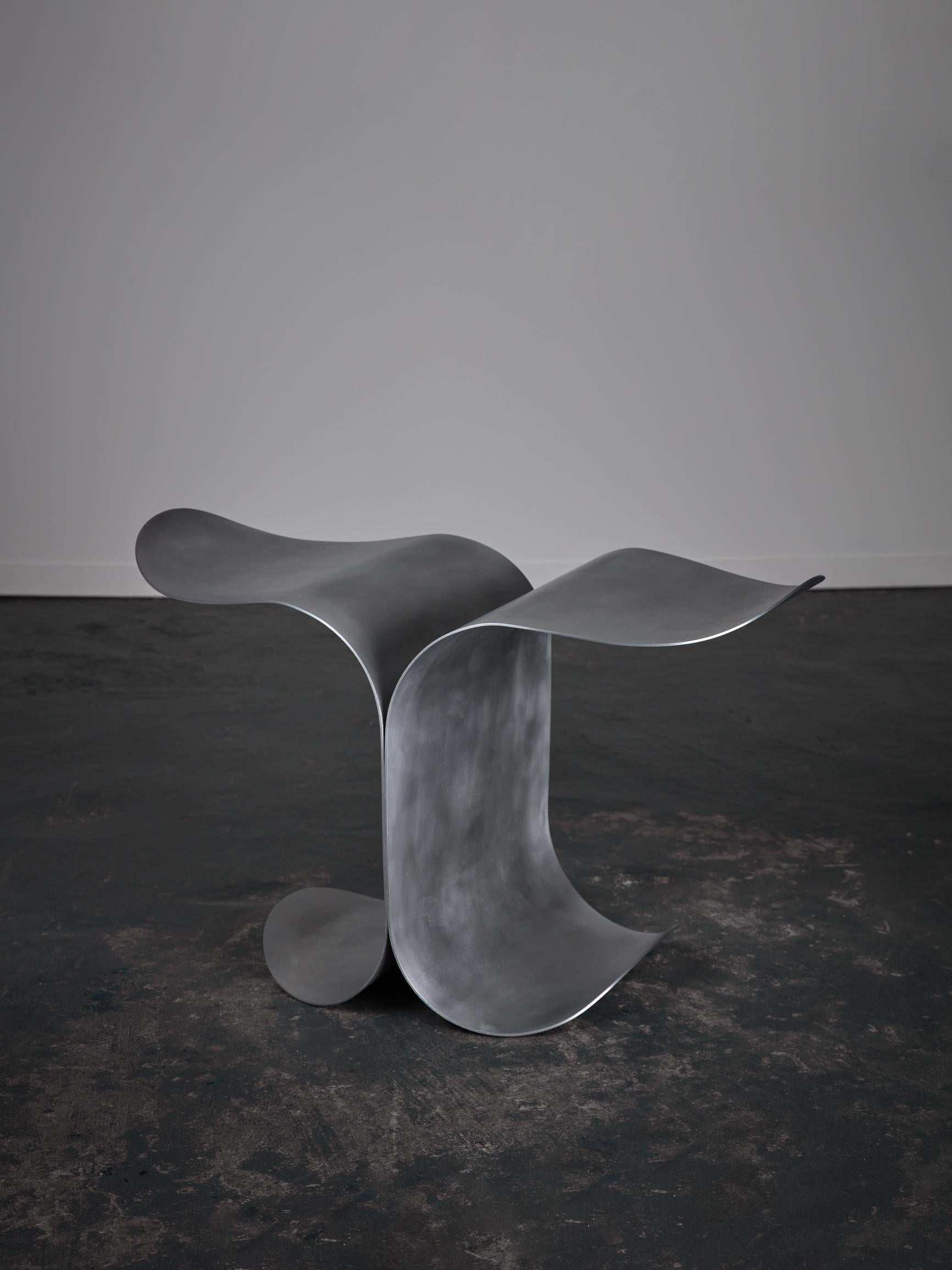 Medium Waves Side Table by Yoon Shun
Dimensions: D 47.5 x W 79 x H 48 cm. 
Materials: Aluminum and silicone. 

This side table is made of 3MM aluminum. Hands machine rolled, polished, and silicon coated. Available in three different sizes and in a