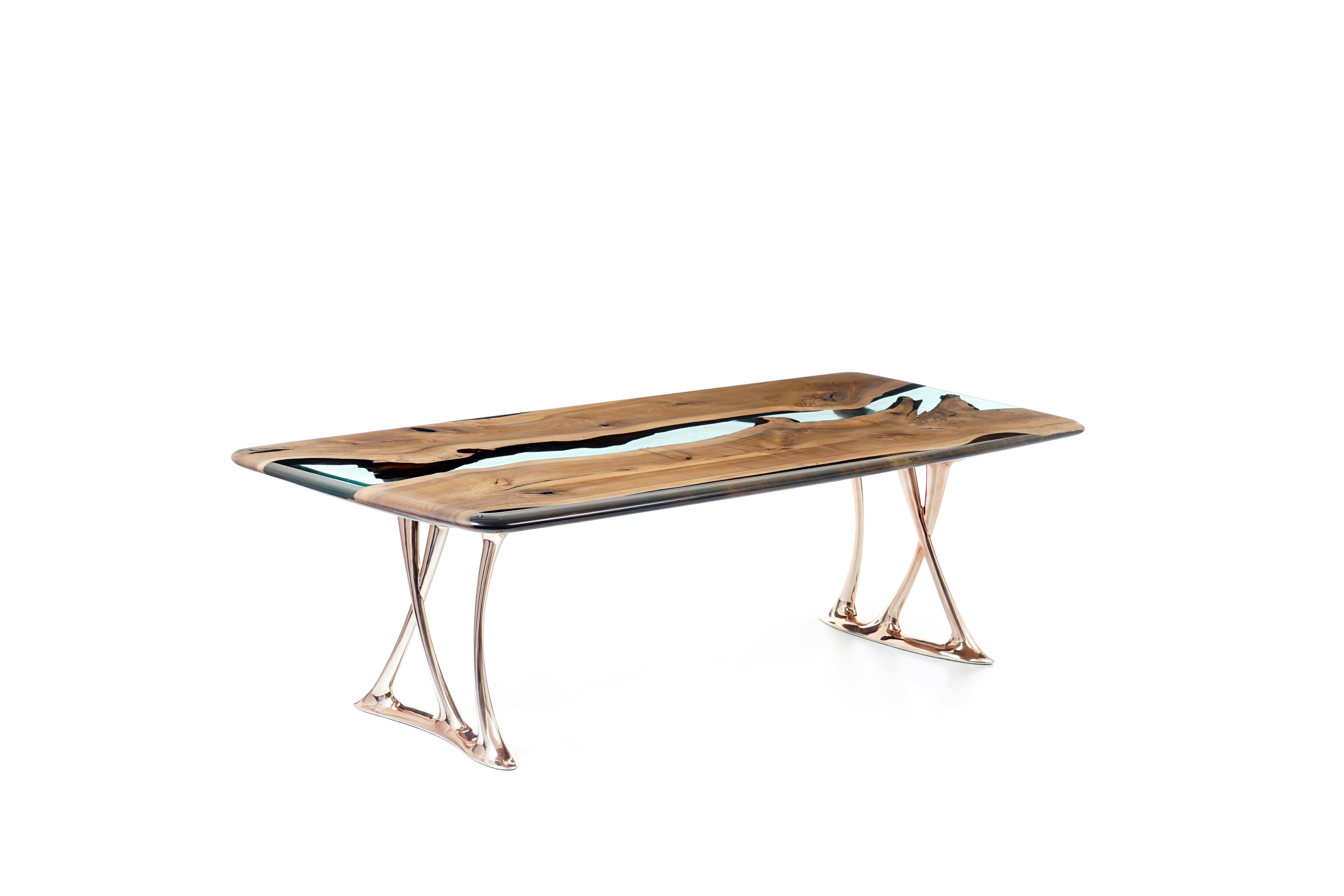 Enhance your dining experience with the exquisite Medma Dining Table, a meticulously crafted masterpiece made from the finest walnut wood with elegant gold-plated aluminum legs. 

This magnificent piece of furniture is designed to make a bold