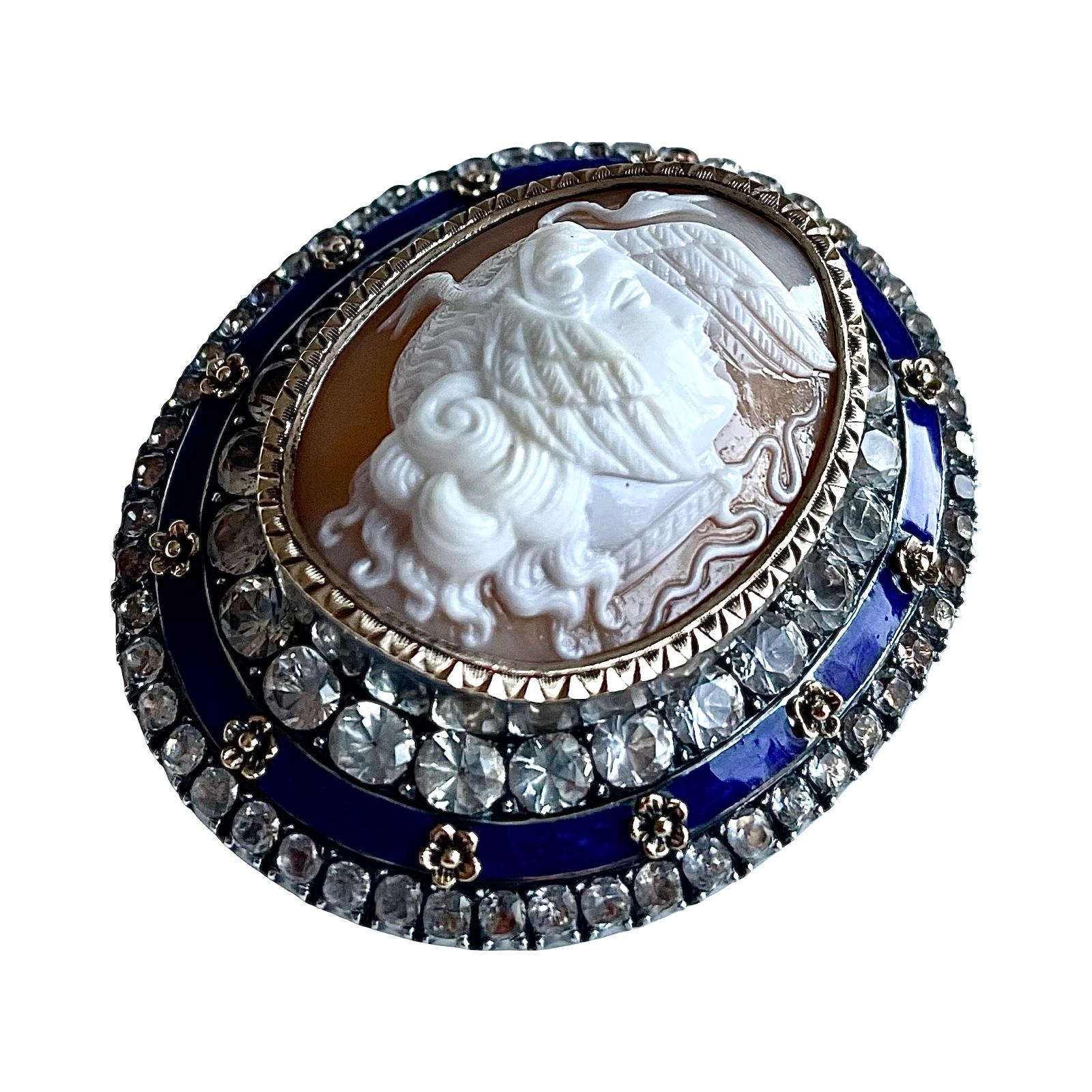 Superb Victorian hand-carved shell cameo brooch from approximately 1880, featuring Medusa, surrounded by cobalt blue enamel and paste stones, set in 925 sterling silver, in excellent condition. This museum quality cameo is surrounded by beautiful