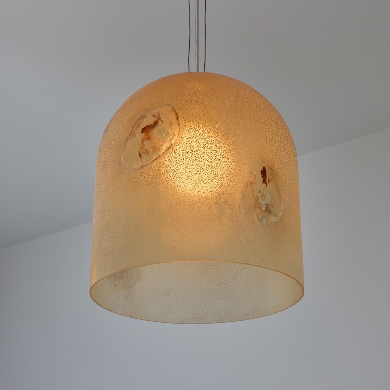 'Medusa' Ceiling Light by Alfredo Barbini (IT, c. 1970s). 

Large capsule shaped pendants featuring a scavo glass technique, allowing for intoxicating visual spotting. Each light holds a single E27 socket type, adapted for the US. We recommend a