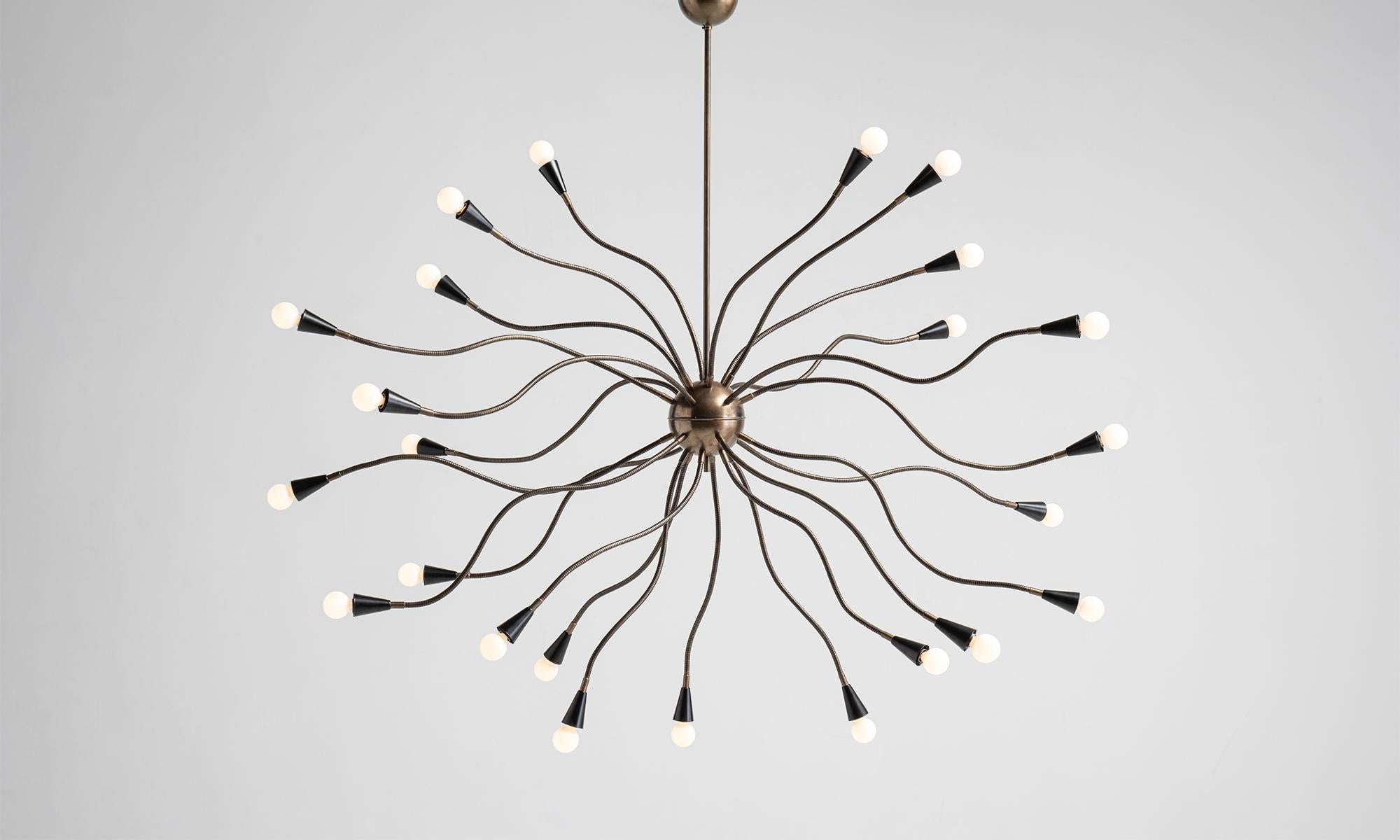 Medusa Chandelier
Italy, 21st Century
Metamorphic chandelier with 25 articulating brass arms and painted black metal shades.
64