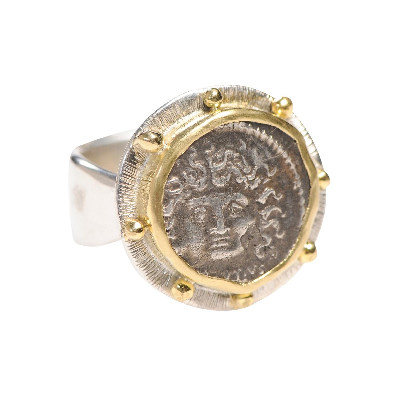 An authentic L. Plautius Plancus, Silver Denarius Coin (47 BC) ring. This Greek coin with Head of Medusa featured prominently has been set in a custom custom ring with a 18k gold and sterling silver bezel (with balled accents) and a sterling silver