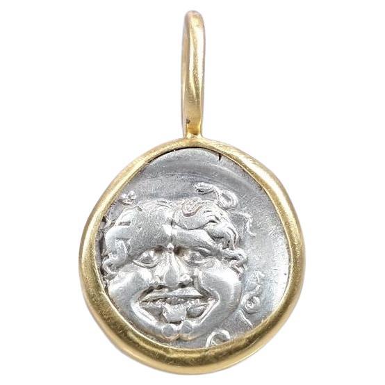 This is truly a gem - with excellent details all around. Here is a video of the coin before I set it and here  how I set this coin!

To appreciate its size, the relief of the coin and the shape of the bail, see the picture showing the coin next to a