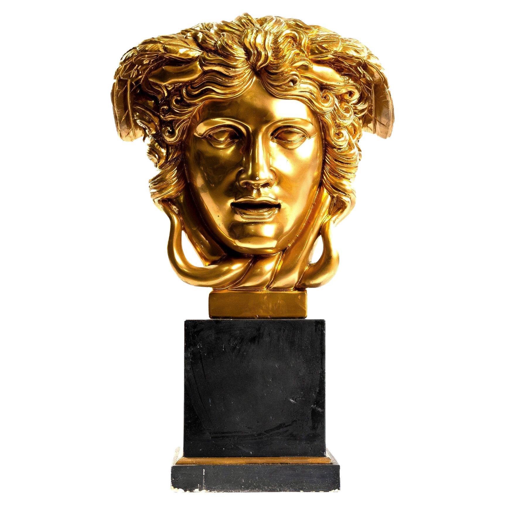 Medusa in gilded marble For Sale