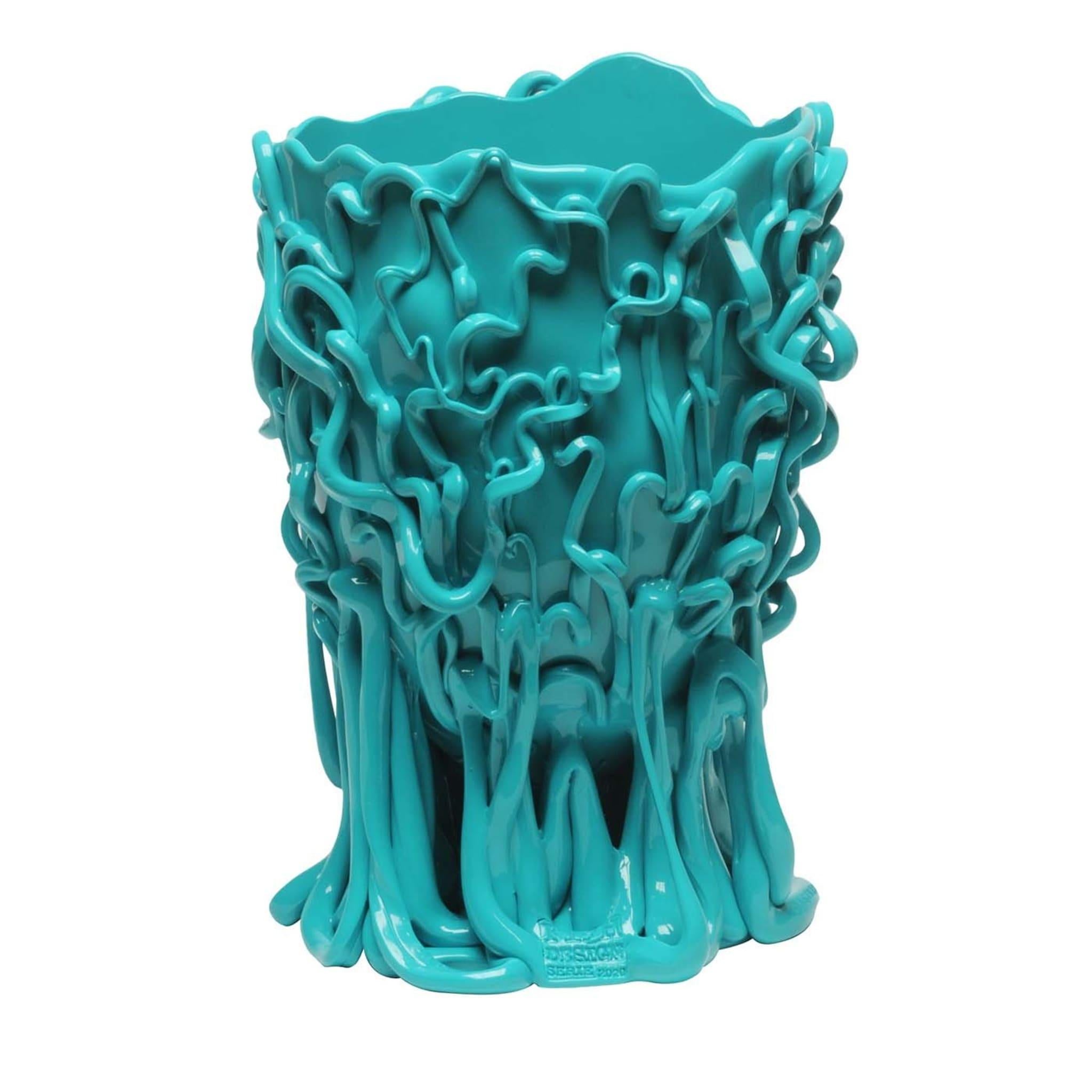 Monochromatic snake-like squiggles slither across the surface of this soft, resin vase in matte blue. This vase was created by one of Italy's most celebrated designers, Gaetano Pesce, in 1995 for the Fish Design Collection — Pesce is the Italian