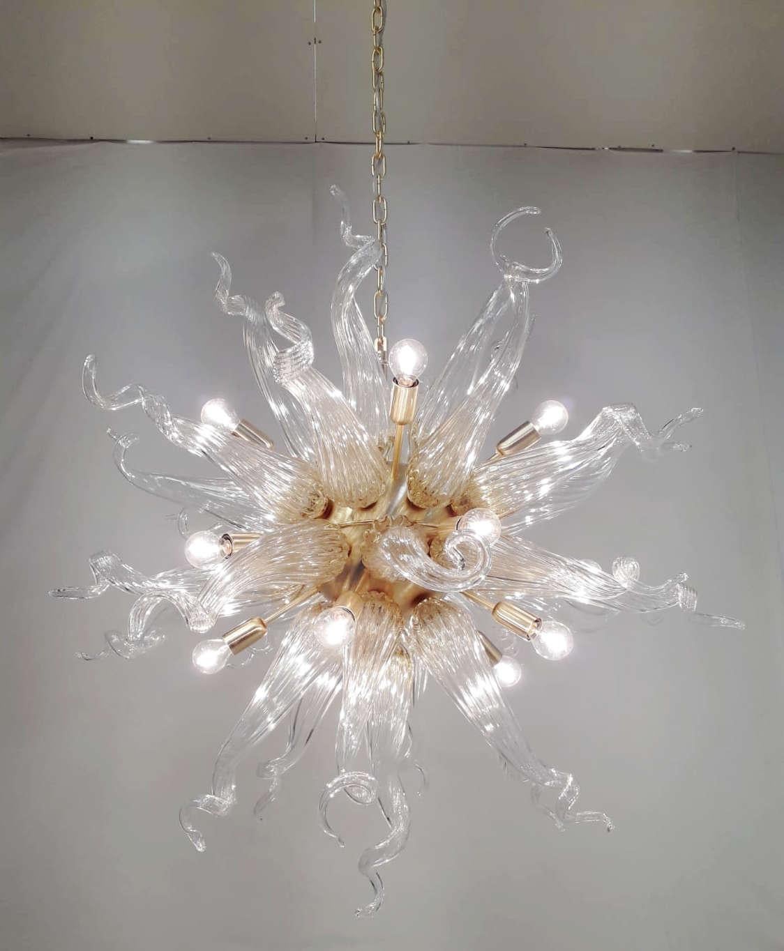 Italian sputnik chandelier shown in clear and amber murano glass with satin gold finish metal frame / designed by Fabio Bergomi for Fabio Ltd / Made in Italy
15 lights / E12 or E14 type / Max 40W each
Measures: Height 33.5 inches plus chain and