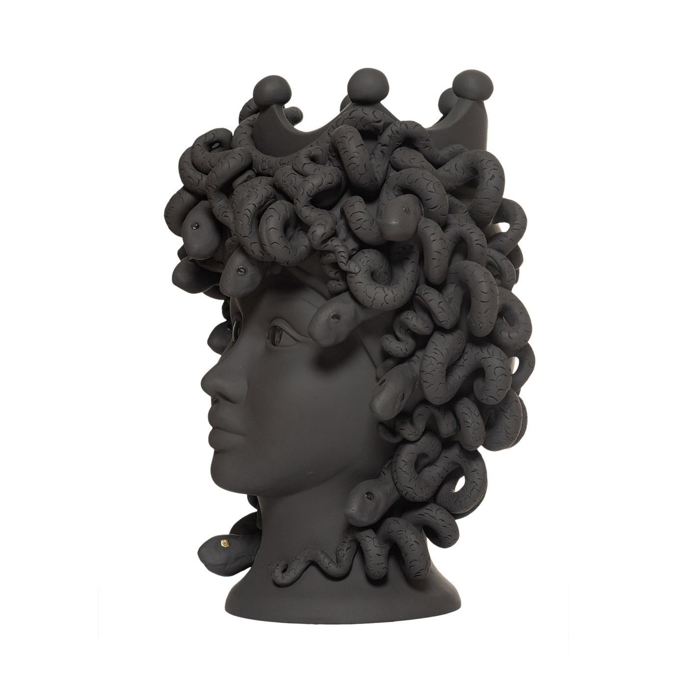 This entirely handmade vase is inspired by the Greek myth of the most famous among the three Gorgons. The vase has a matte finish, with a particularly intense tint between a very dark brown color and black. The eyes, both the girl's and snakes' -