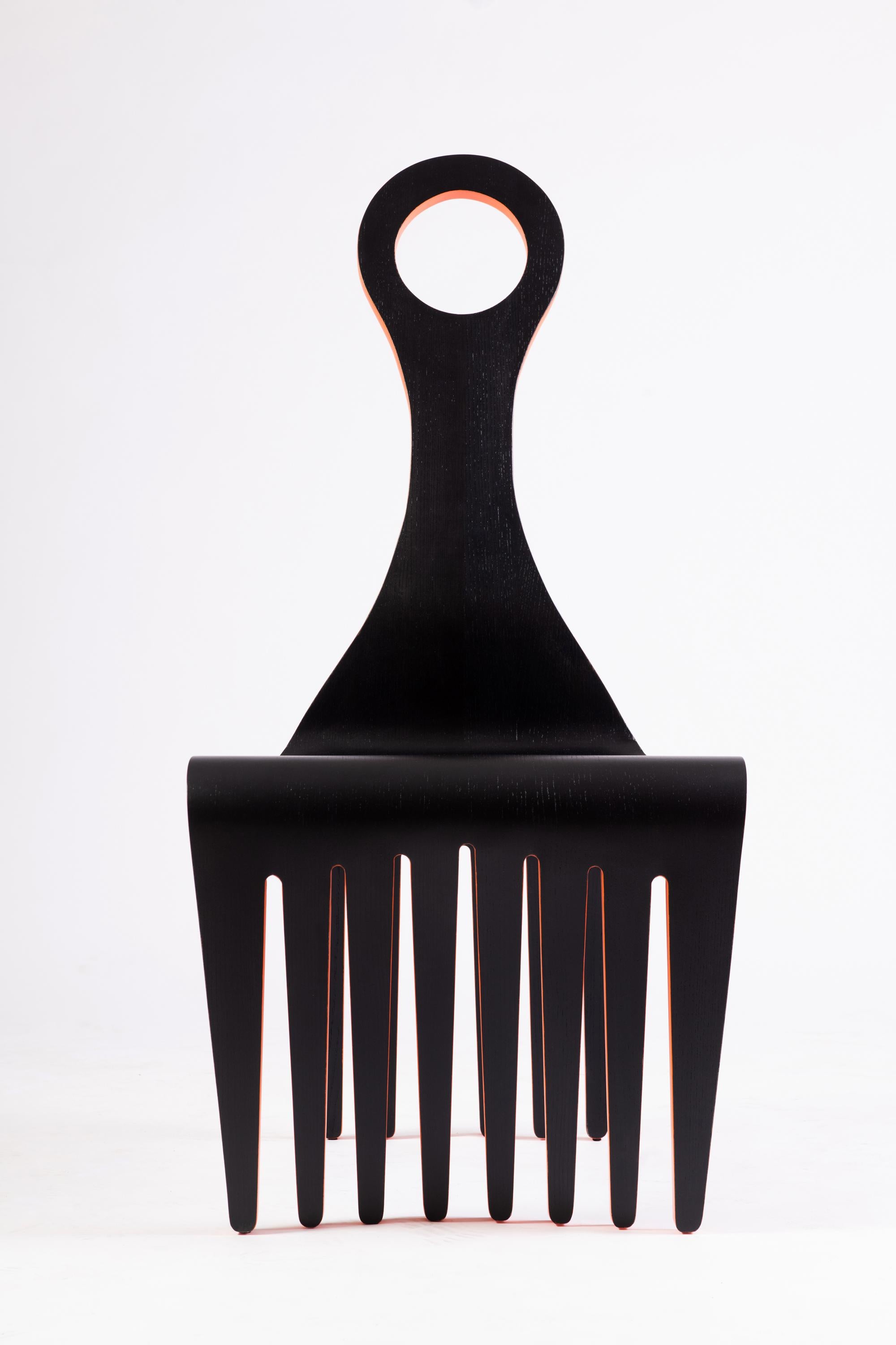 Jomo Tariku
Meedo Chair, 2022
Ebonized and painted ash
43 x 22 x 23 in
Ed. 1/18
 
The Meedo Chair design unites the rich history of the Afro Comb with the African tradition of a ceremonial seat signifying leadership, unity and kinship. The